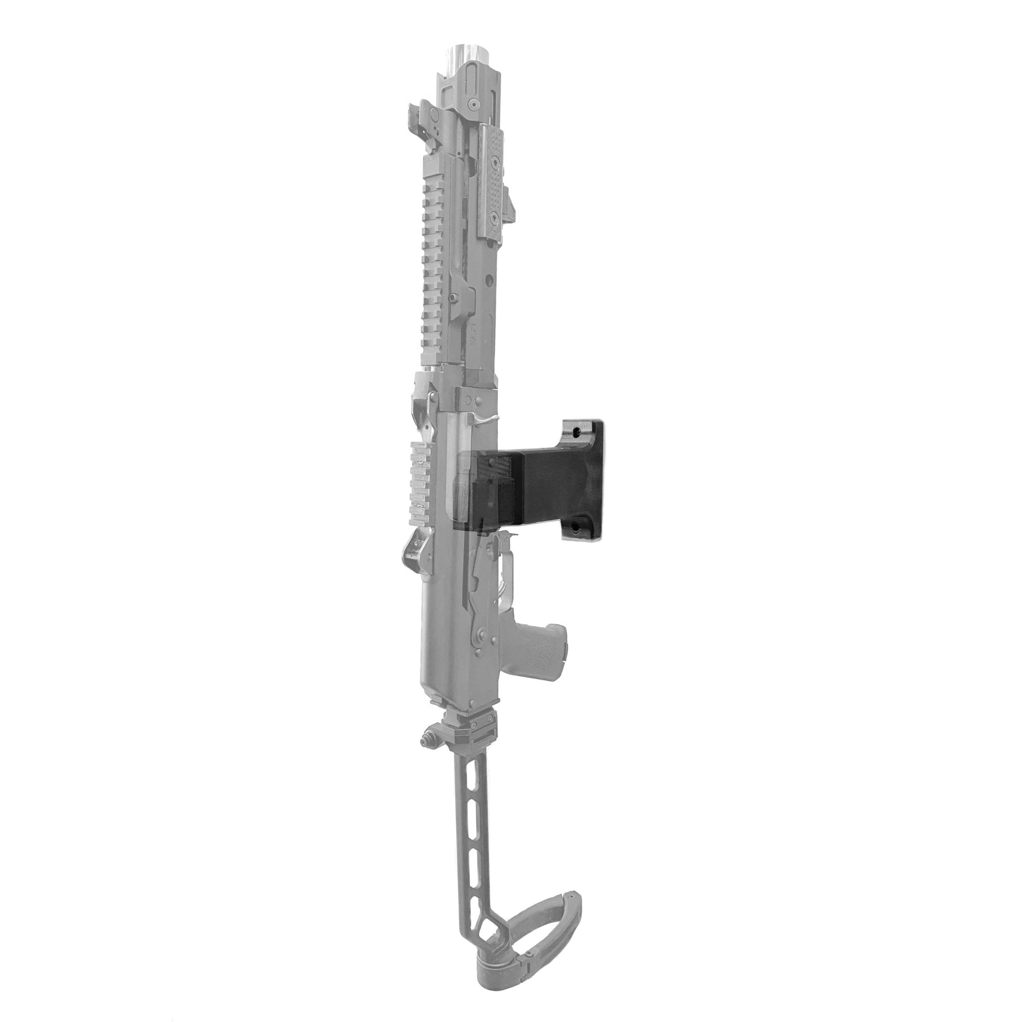 AK-47 rifle shown mounted vertically on the Spartan Mounts wall hook for space-saving gun room display