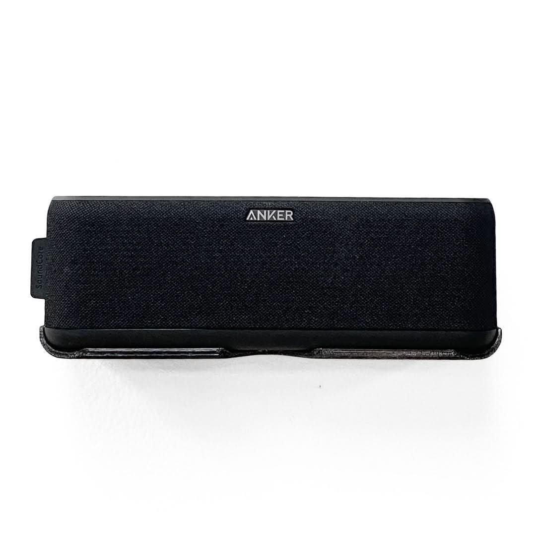 Anker Soundcore Boost speaker shown mounted on the Spartan Mounts wall mount for a clean, space-saving setup