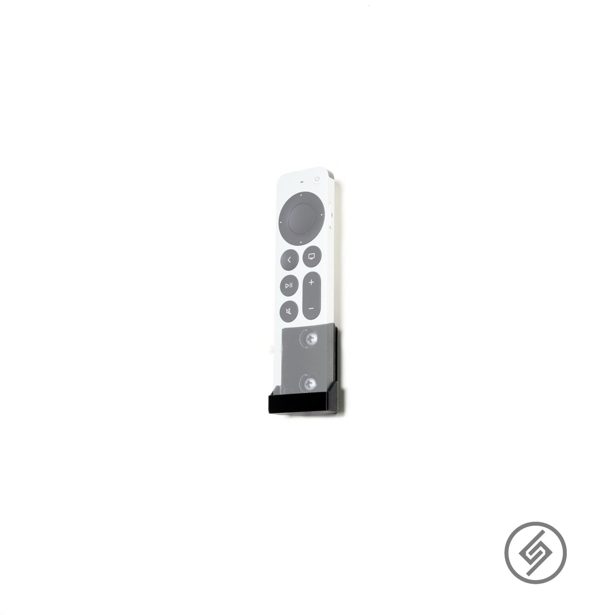 Apple TV remote shown mounted on the Spartan Mounts wall mount for a clean, easy-access setup
