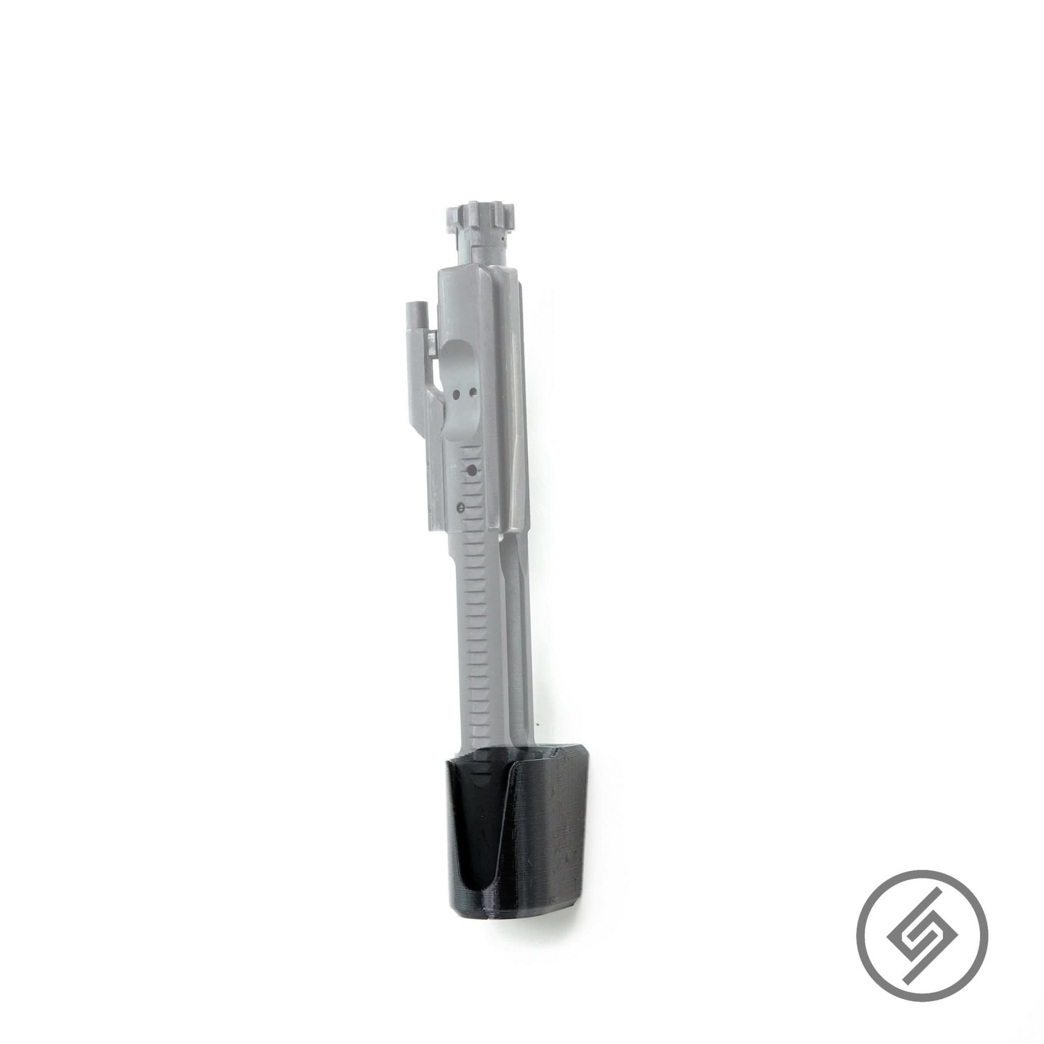 AR-15 bolt carrier group shown mounted on the Spartan Mounts wall mount for organized, off-the-floor storage