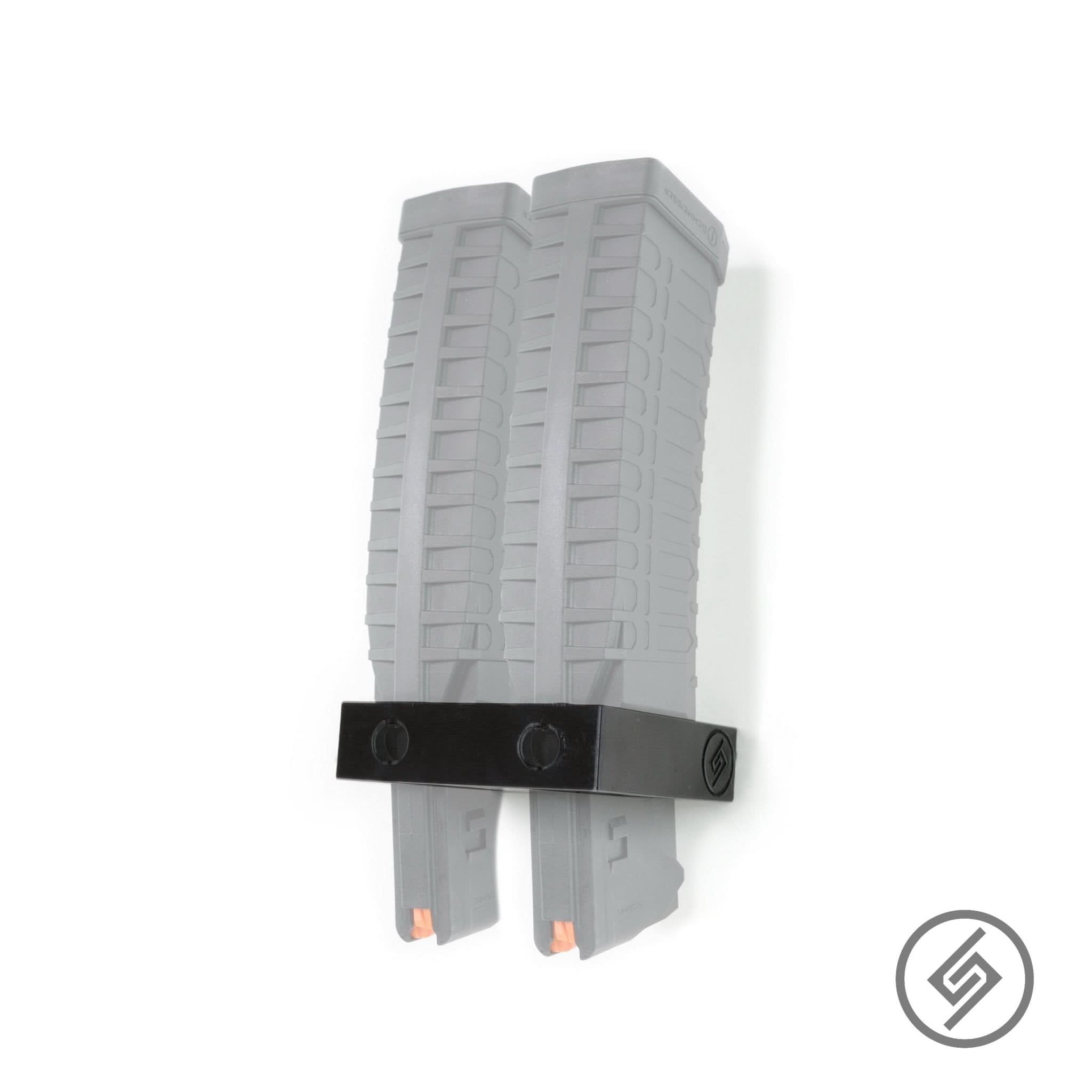 ATI Schmeisser S60 magazines shown loaded in the Spartan Mounts wall rack for organized, off-the-floor storage