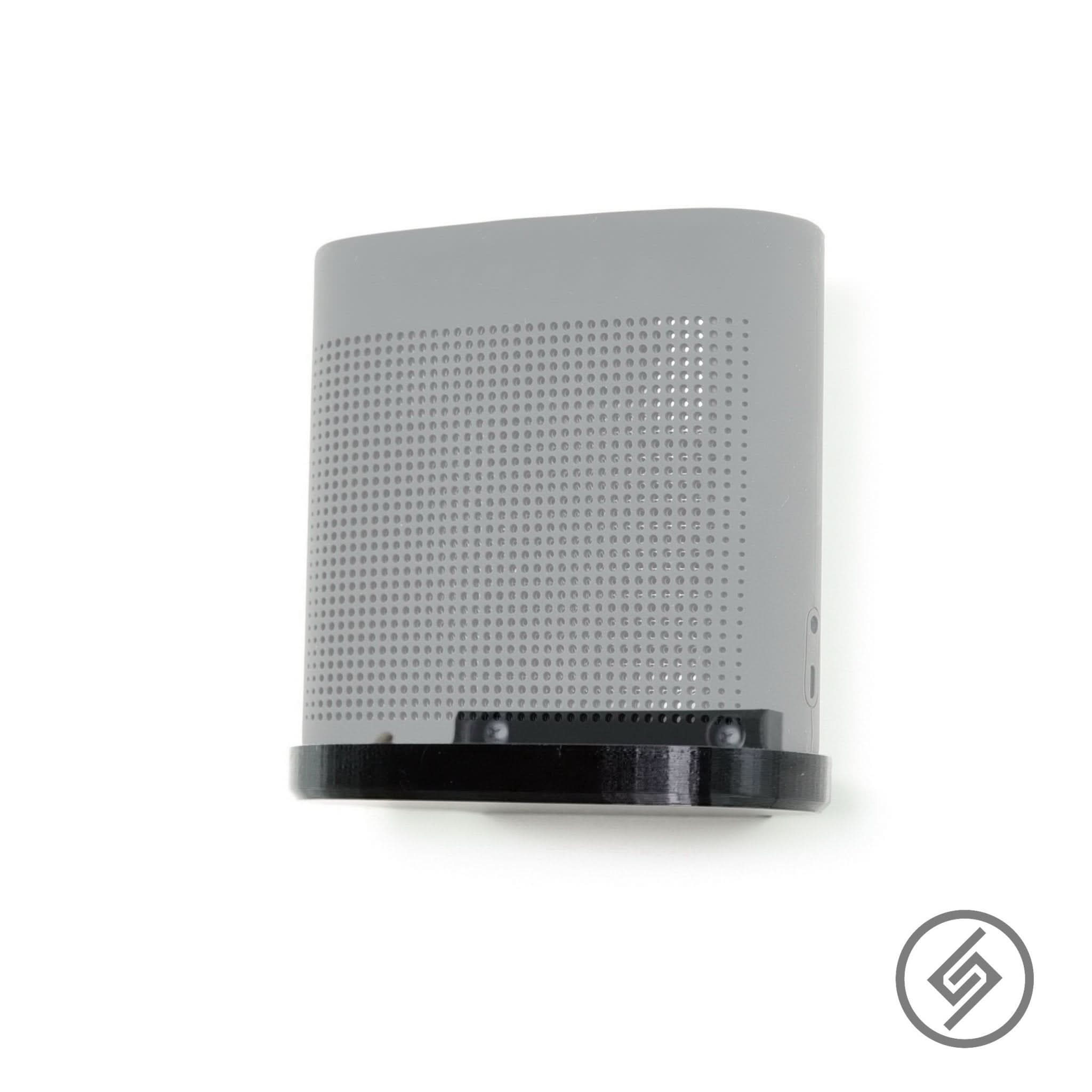 Bose SoundLink Color II speaker shown mounted on the Spartan Mounts wall mount for a clean, space-saving setup
