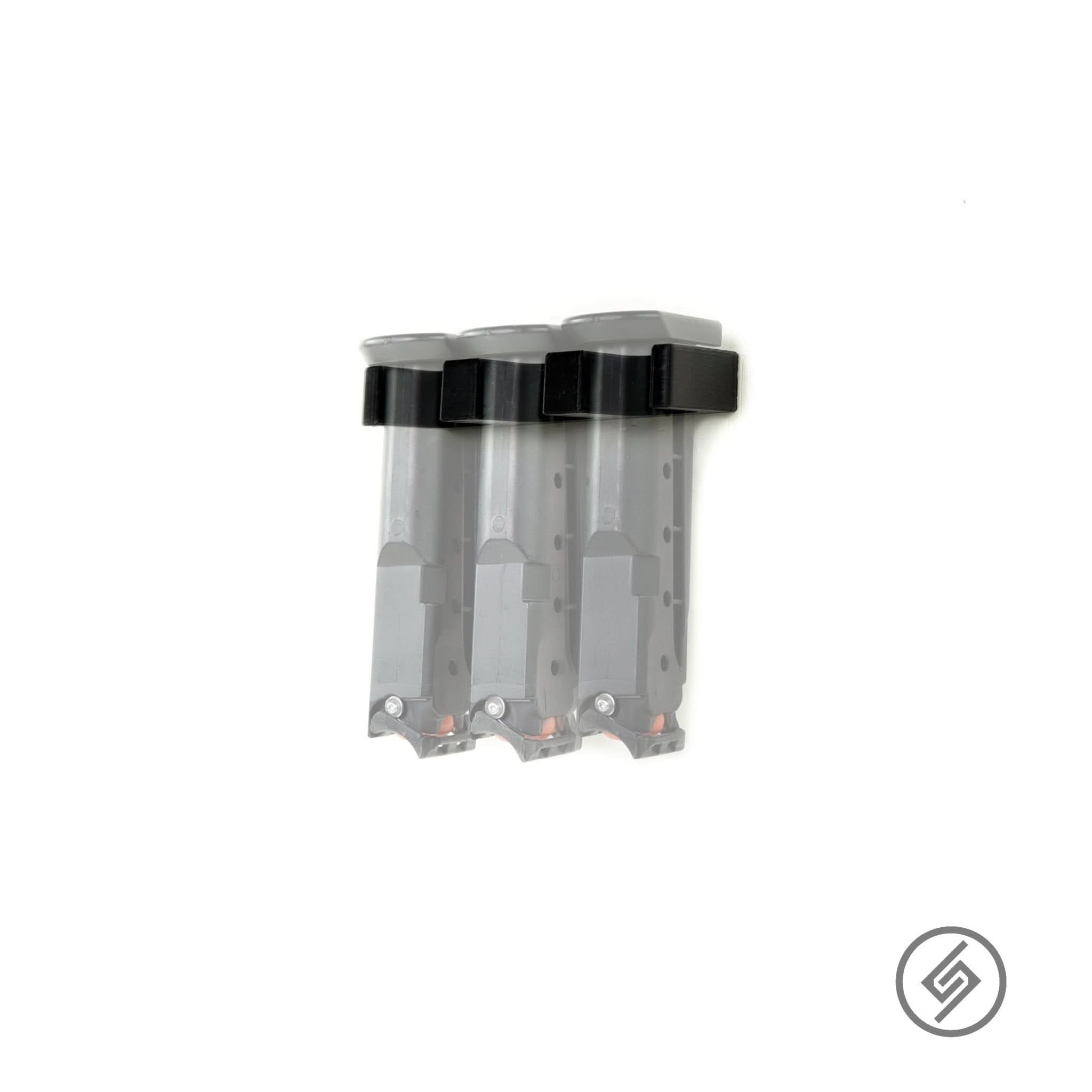 Byrna LE/SD/SD-XL magazines shown loaded in the Spartan Mounts wall rack for organized, off-the-floor storage