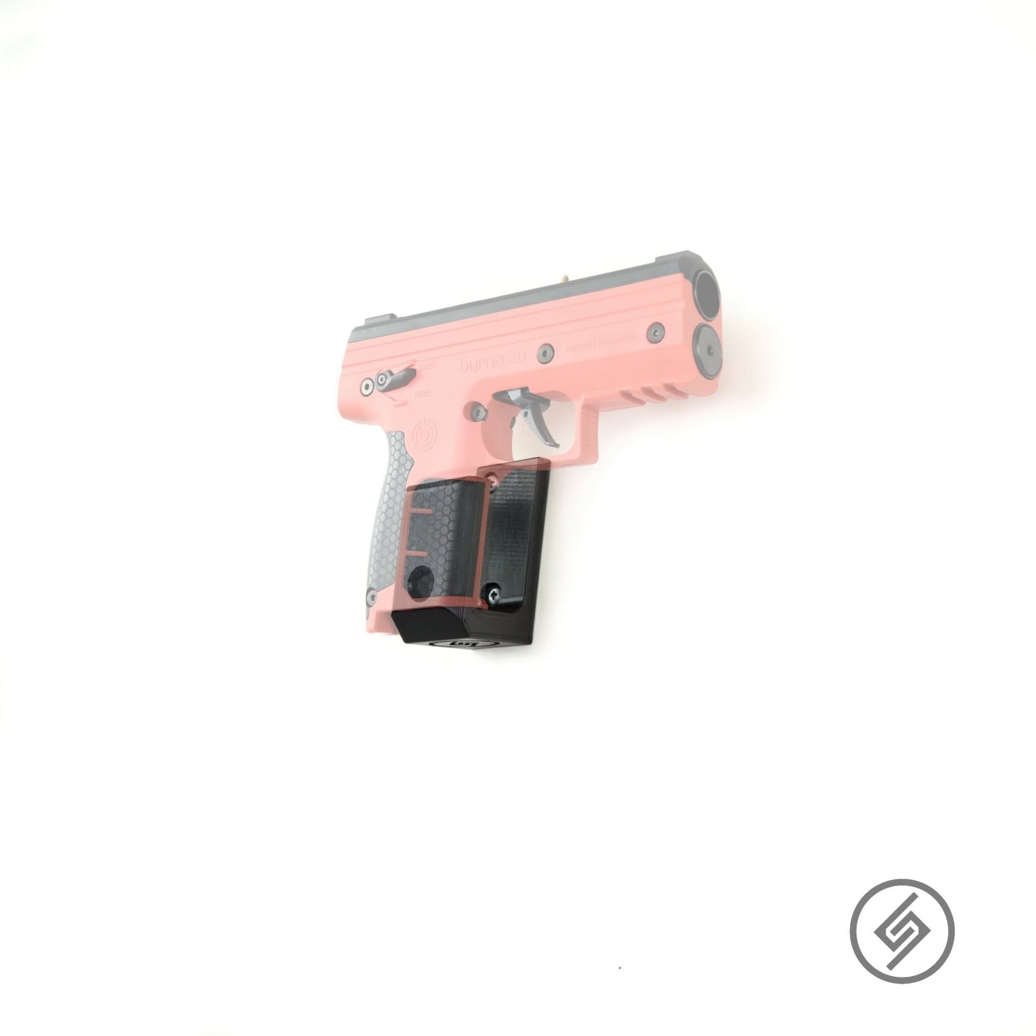 Byrna LE/SD/SD-XL launcher shown mounted on the Spartan Mounts wall hook for a clean, quick-access display