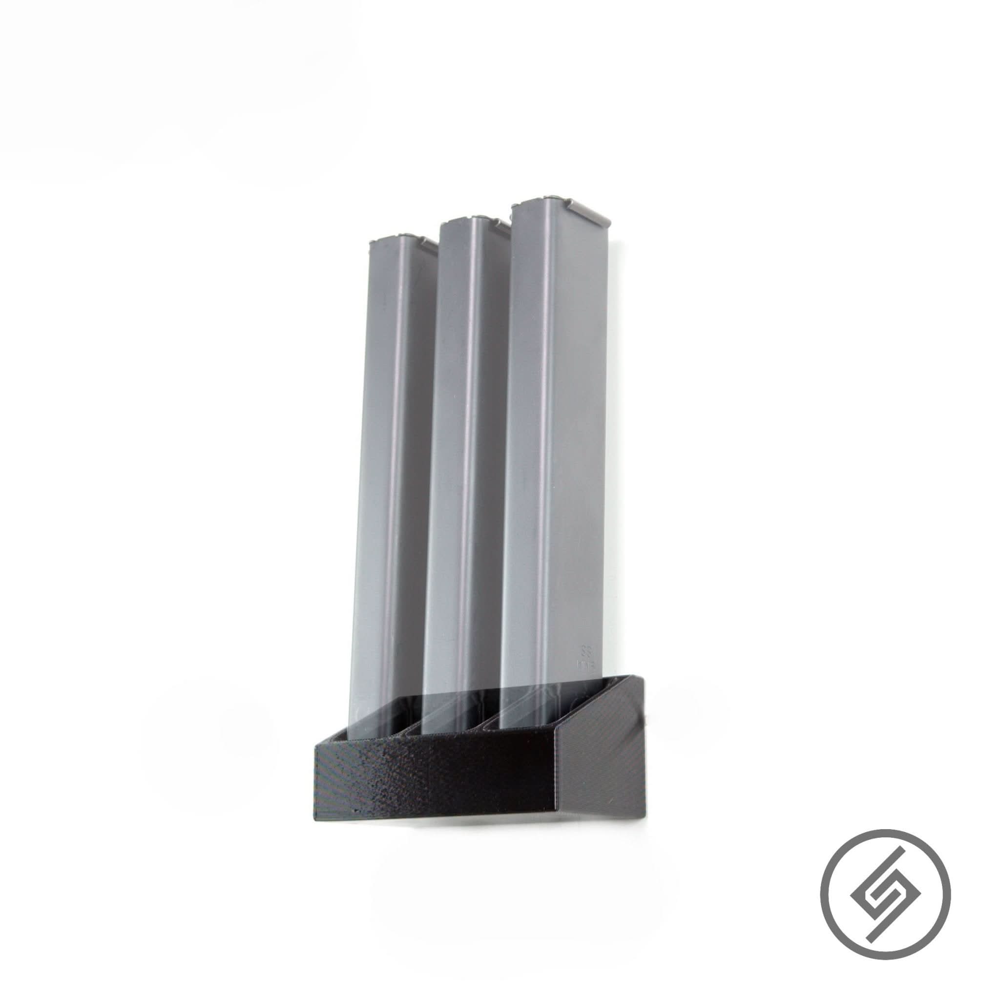 Colt 9mm magazines shown loaded in the Spartan Mounts wall rack for a clean, space-saving display