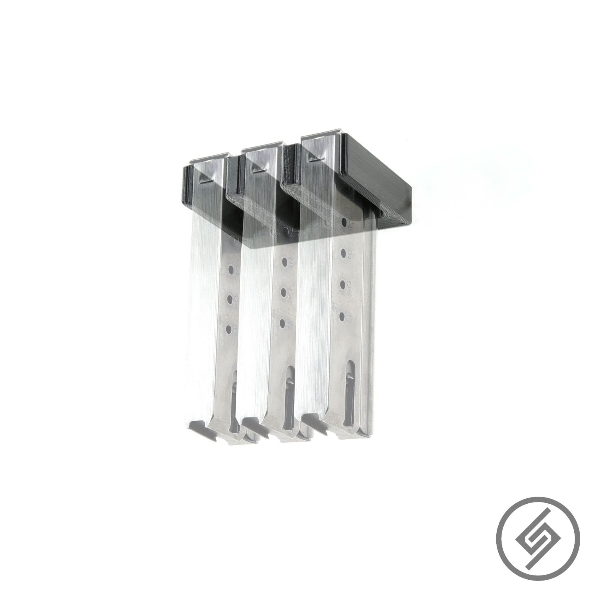 Desert Eagle .50 and .44 magazines shown loaded in the Spartan Mounts wall rack for organized, off-the-floor storage