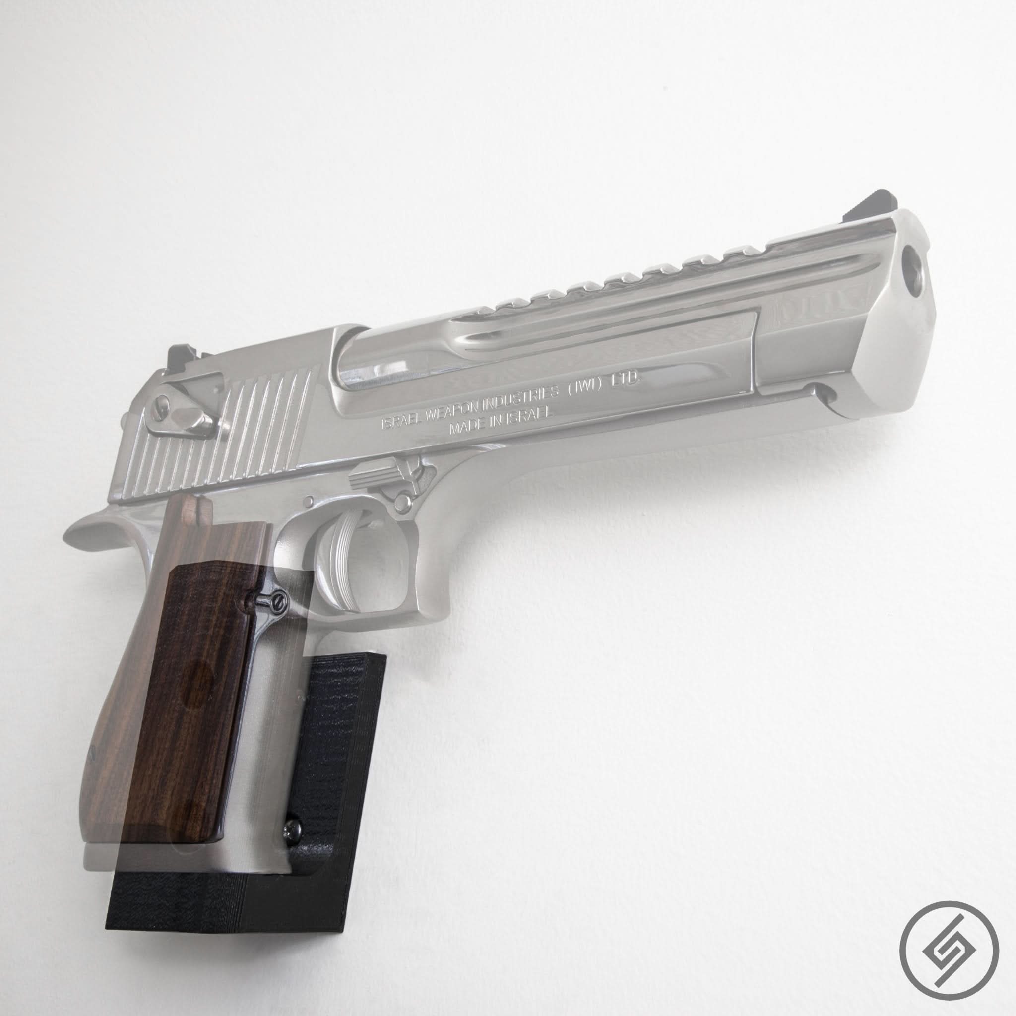 Desert Eagle pistol shown mounted on the Spartan Mounts wall hook for a clean, quick-access display