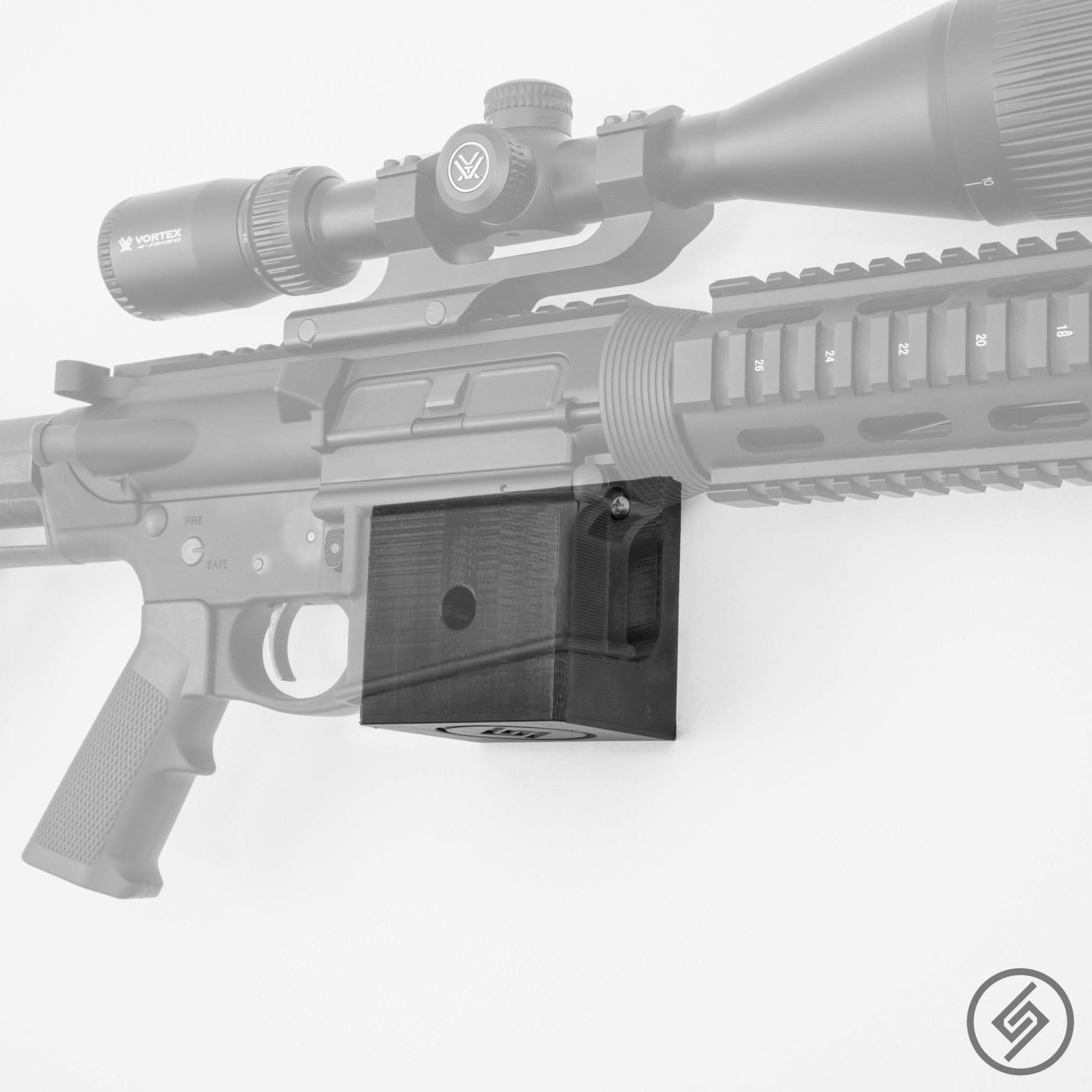 DPMS .308 rifle shown mounted on the Spartan Mounts wall hook, keeping the rifle accessible and clutter-free