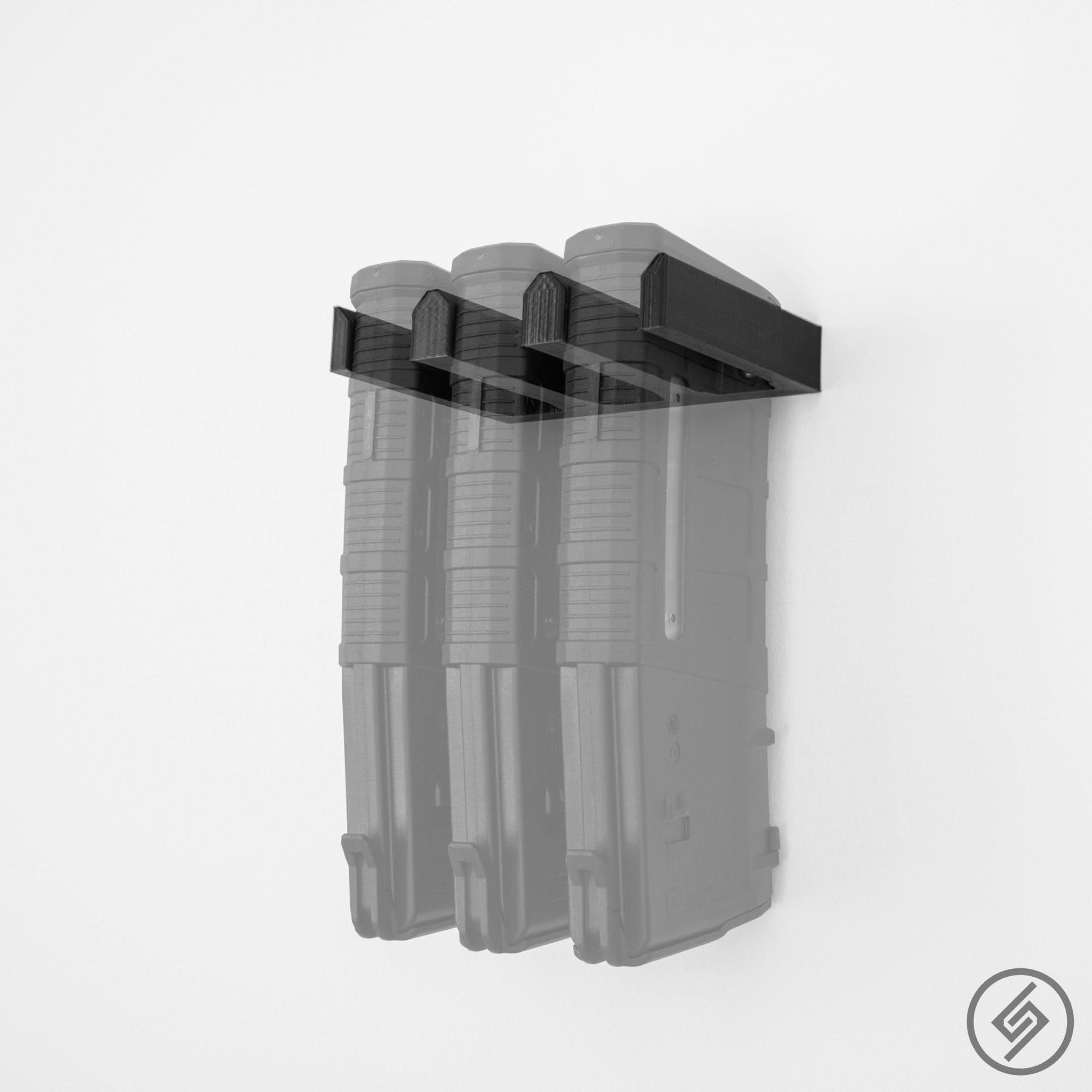 Three AR-10 HexMag magazines shown loaded in the Spartan Mounts wall rack for organized, off-the-floor storage