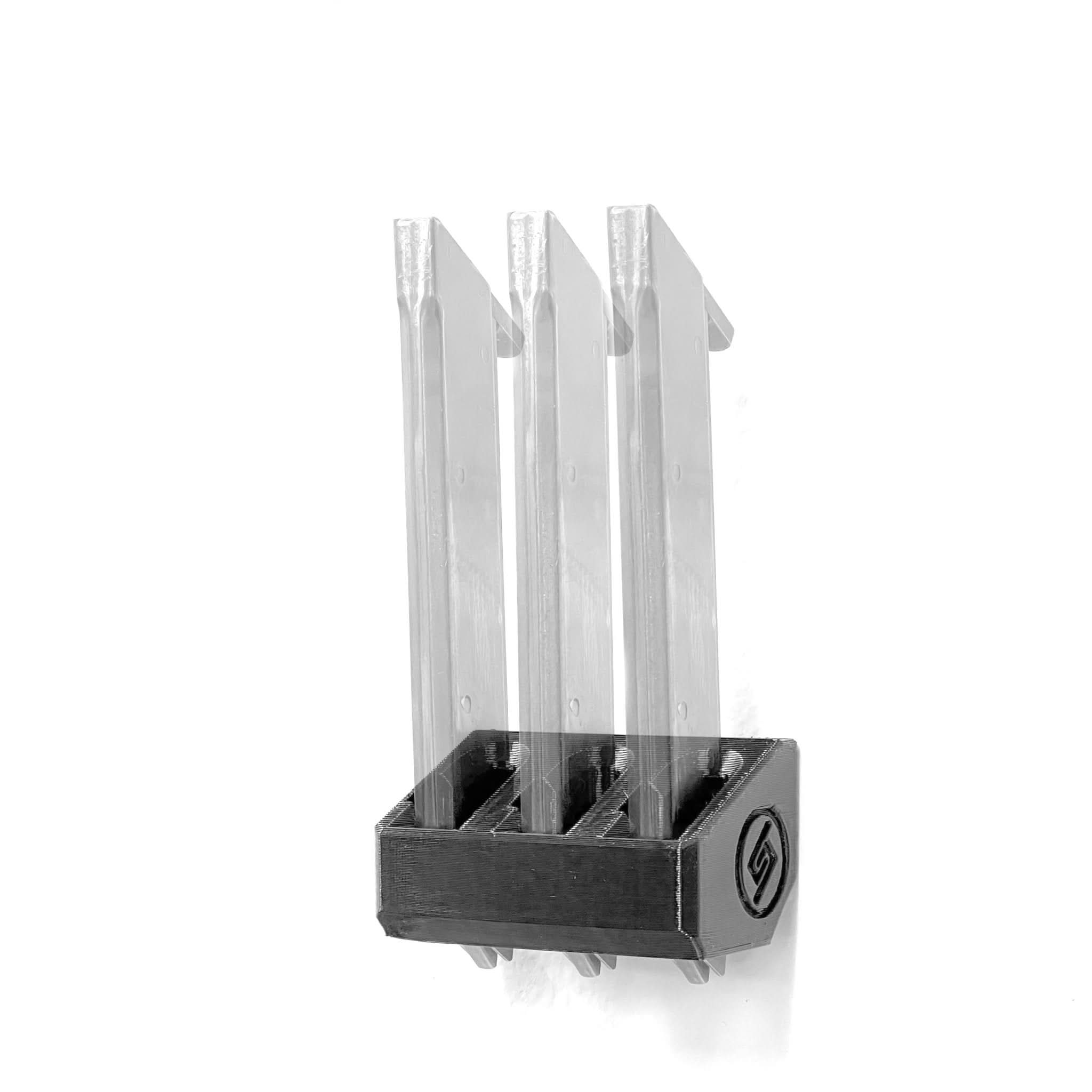 High Standard .22 magazines shown loaded in the Spartan Mounts wall rack for organized, off-the-floor storage