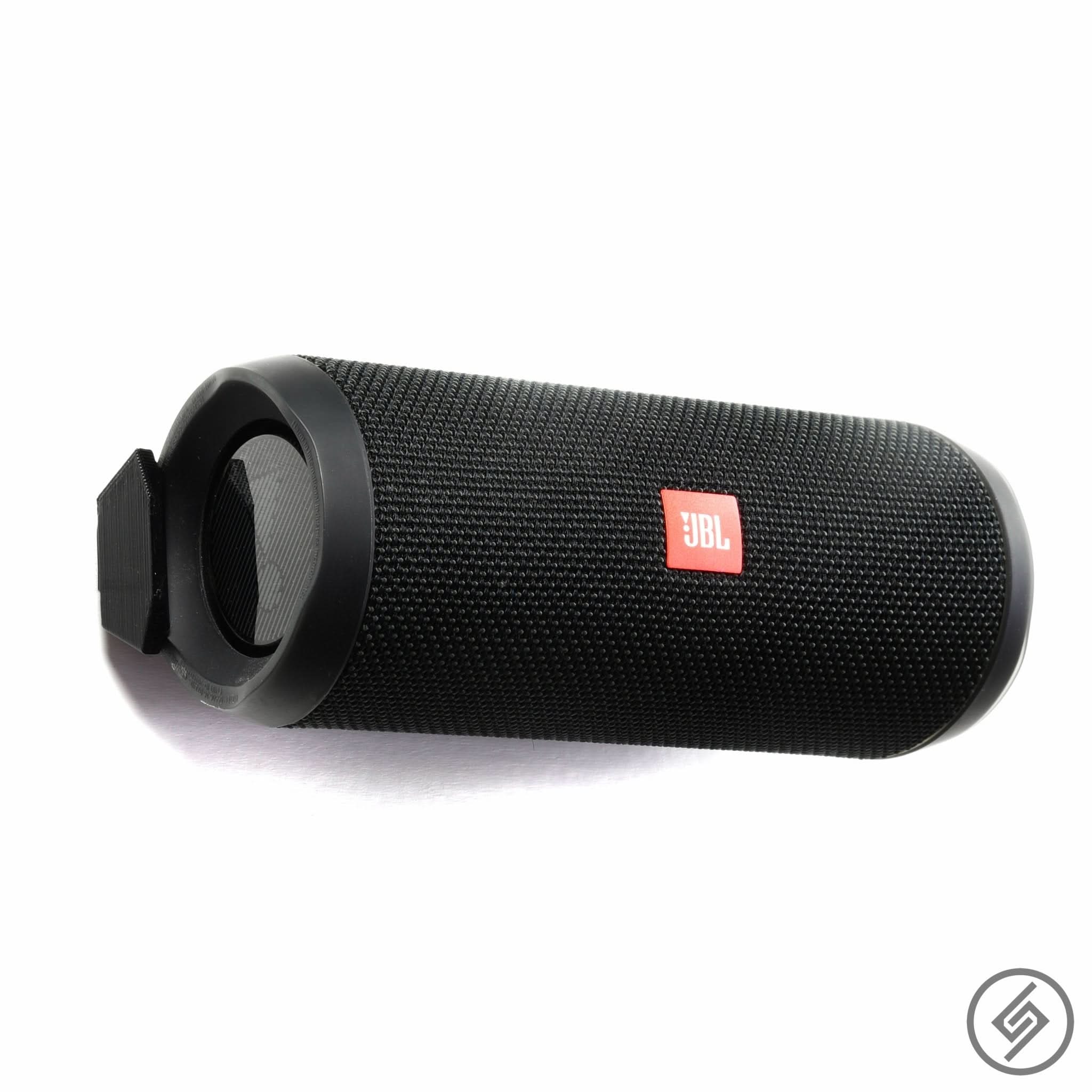 JBL Flip 5 speaker shown mounted on the Spartan Mounts wall mount for a clean, space-saving setup