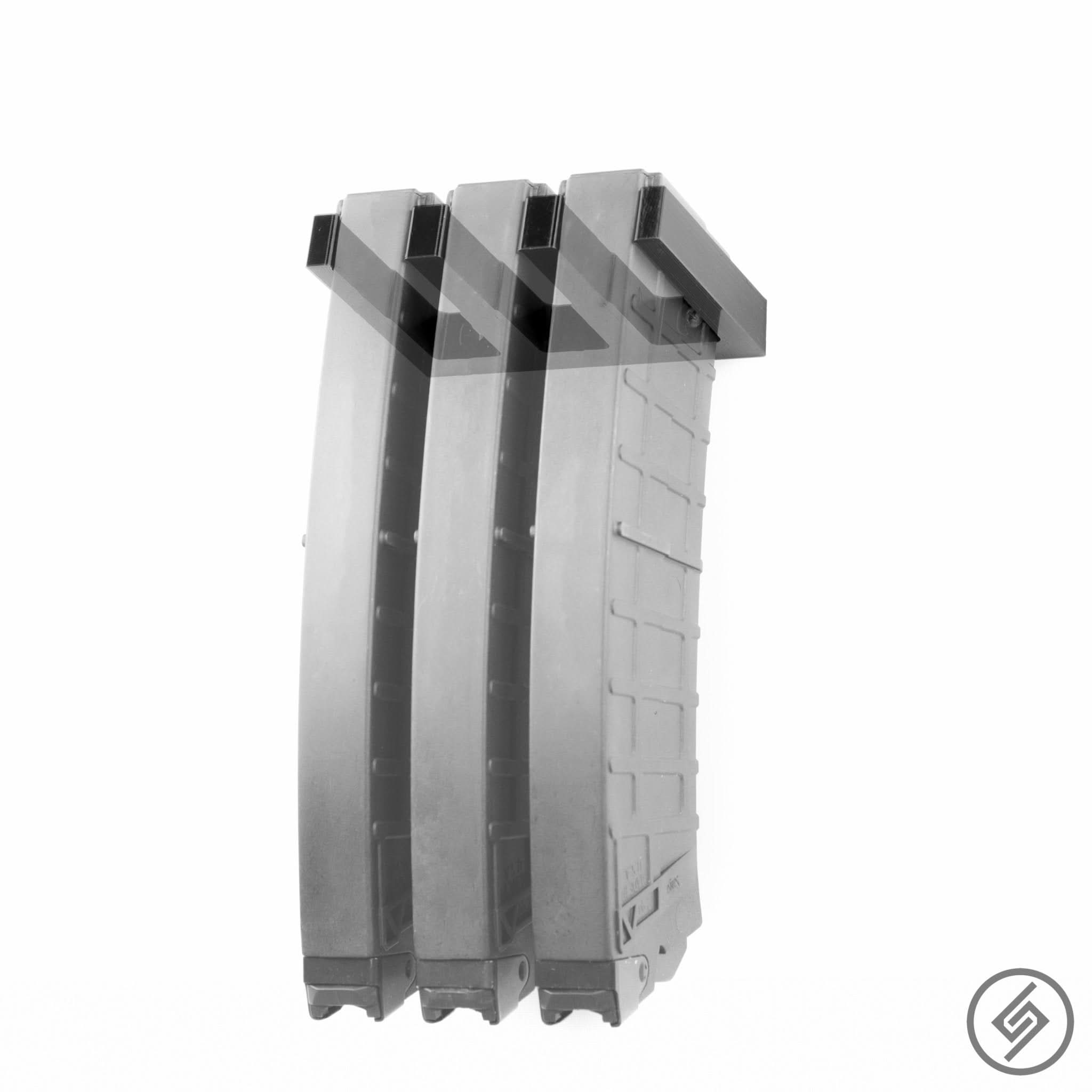 Kalashnikov 12 gauge magazines shown loaded in the Spartan Mounts wall rack for organized, off-the-floor storage