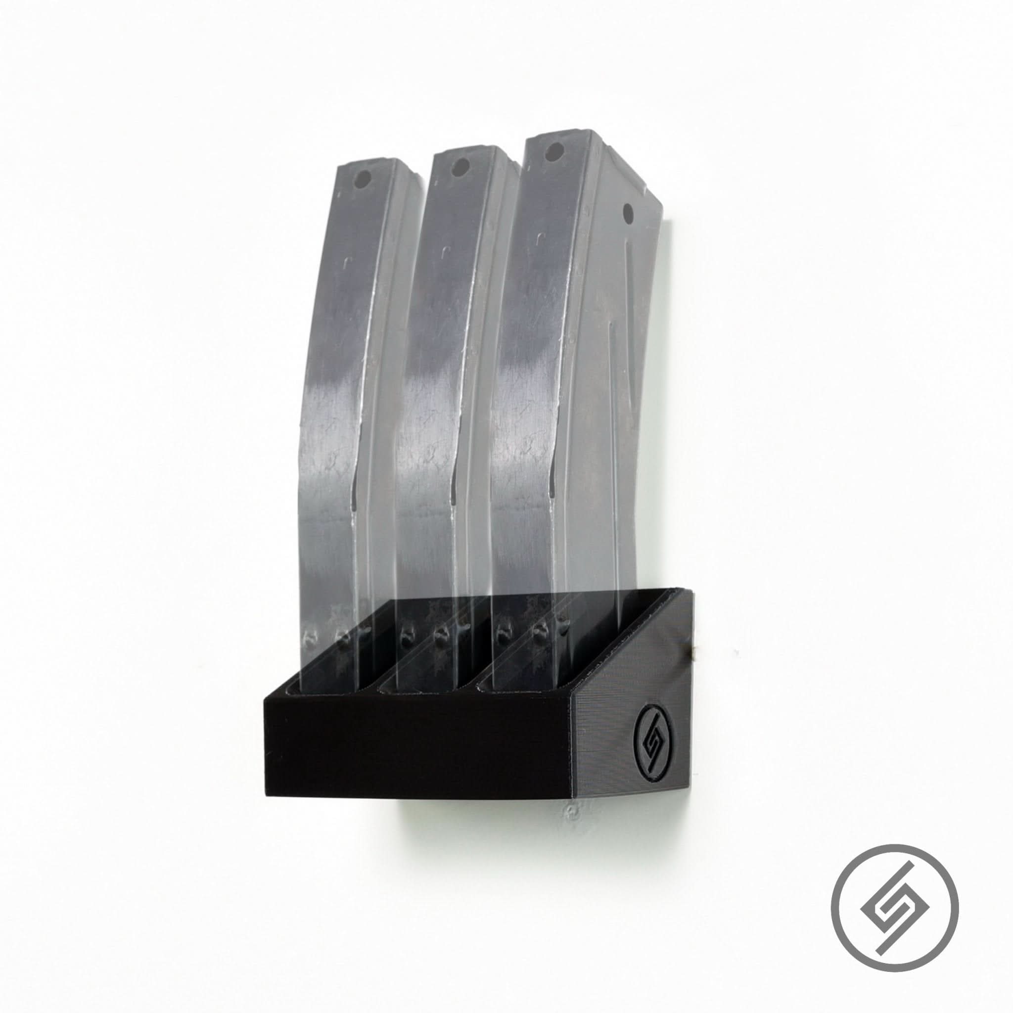 M1 Carbine magazines shown loaded in the Spartan Mounts wall rack for organized, off-the-floor storage