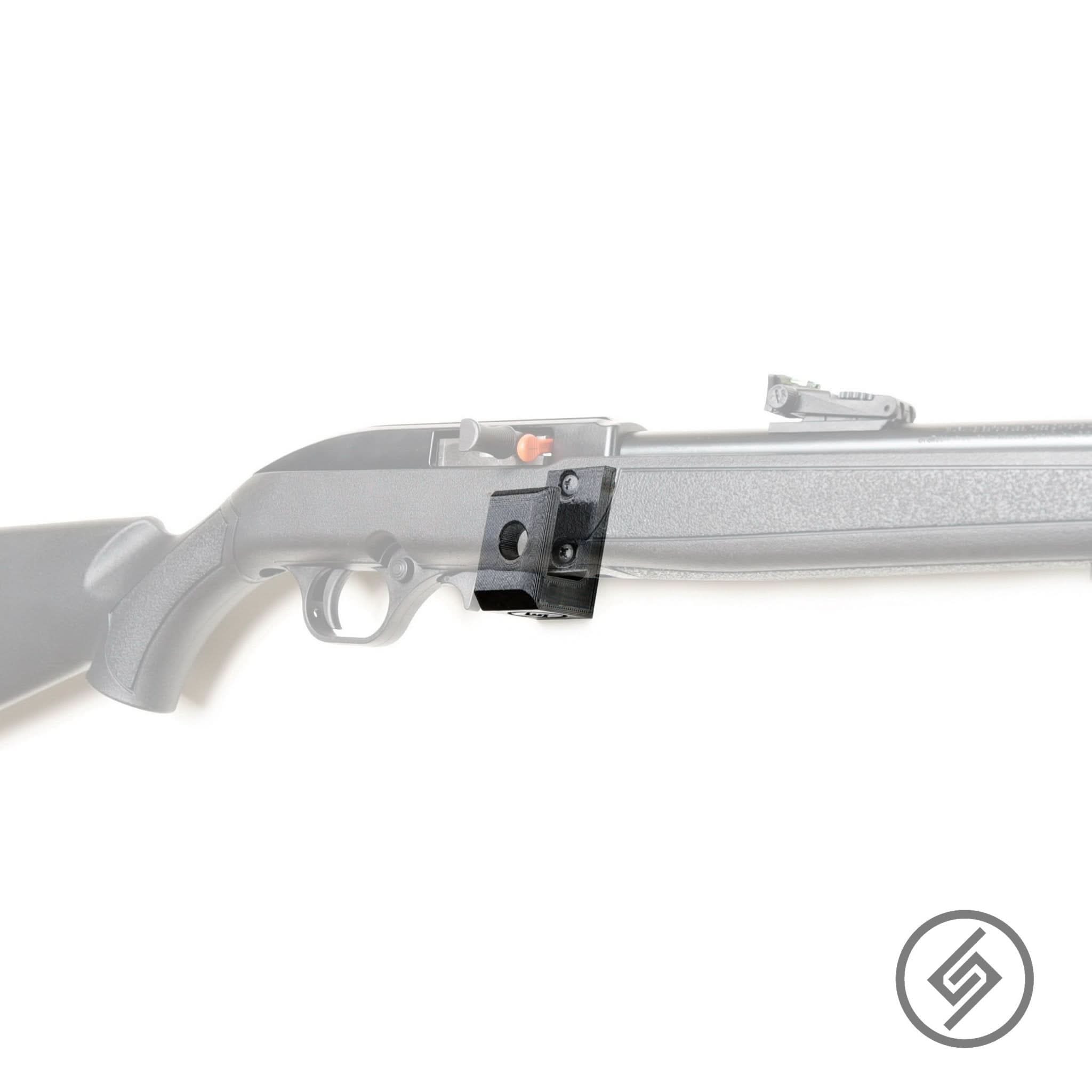 Mossberg 702 Plinkster rifle shown mounted on the Spartan Mounts wall hook for secure, quick-access storage