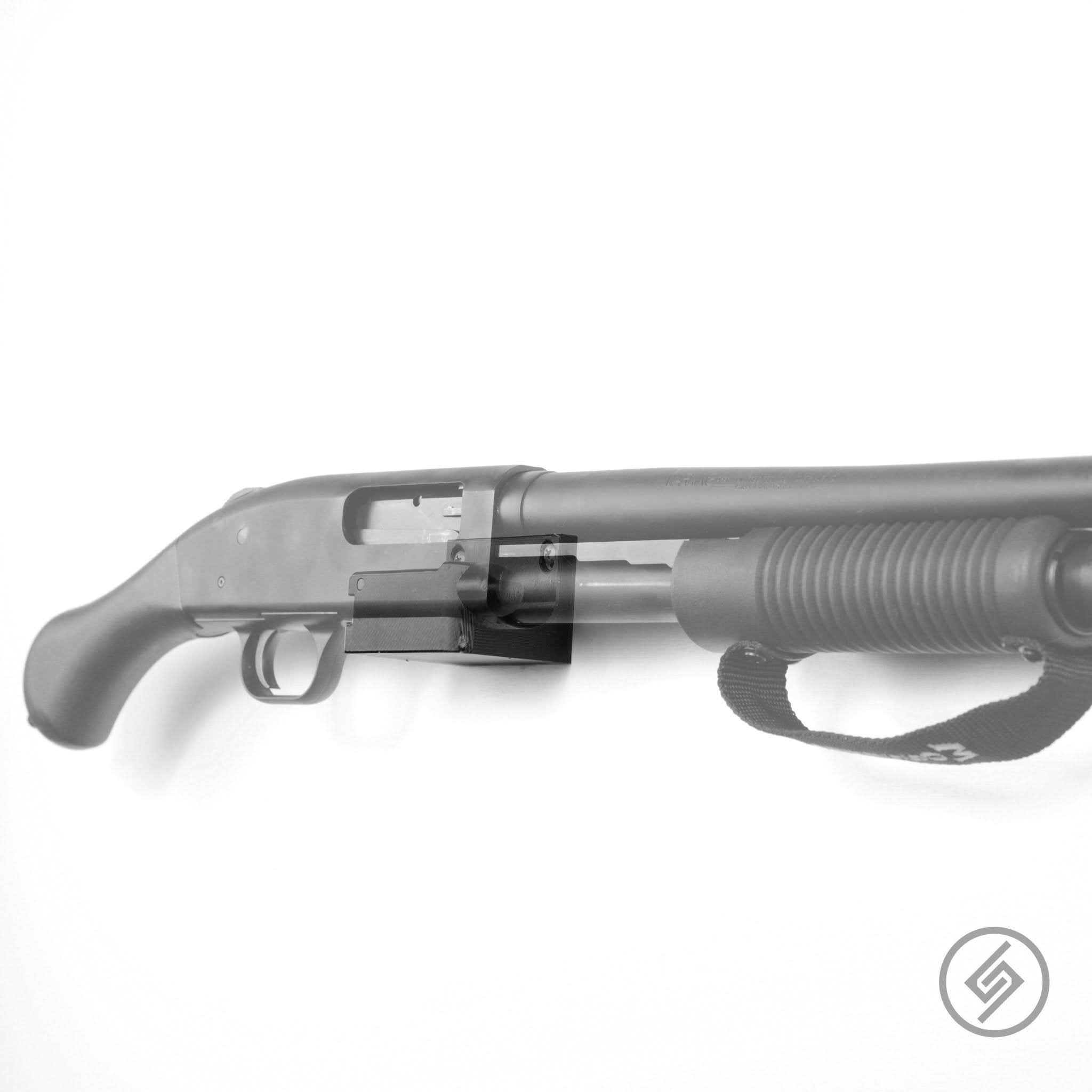 Mossberg 88/500/590 shotgun shown mounted on the Spartan Mounts deep wall hook for secure, quick-access storage