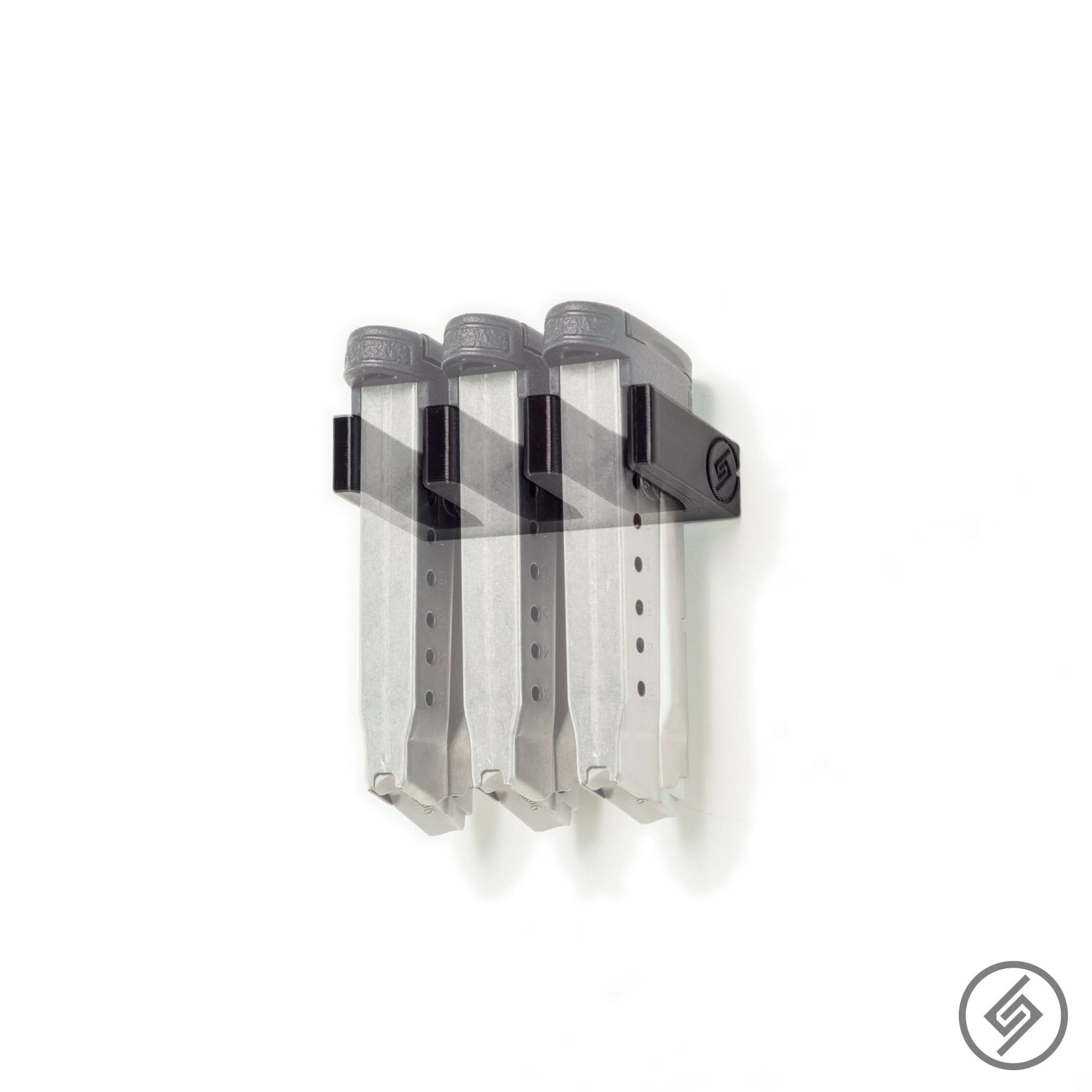 M&P Shield magazines shown loaded in the Spartan Mounts wall rack for organized, off-the-floor storage