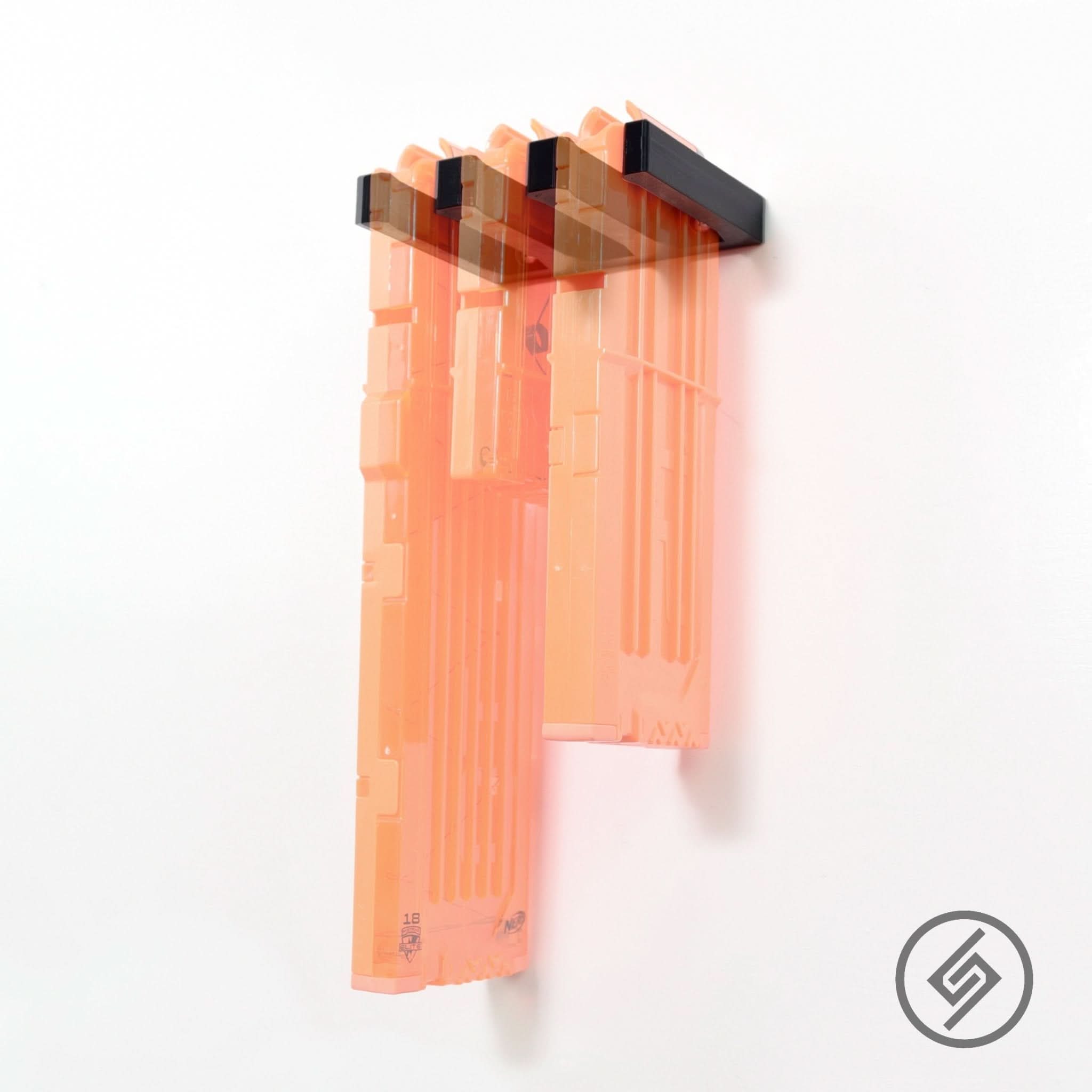 Nerf blaster magazines shown loaded in the Spartan Mounts wall rack for organized, off-the-floor storage