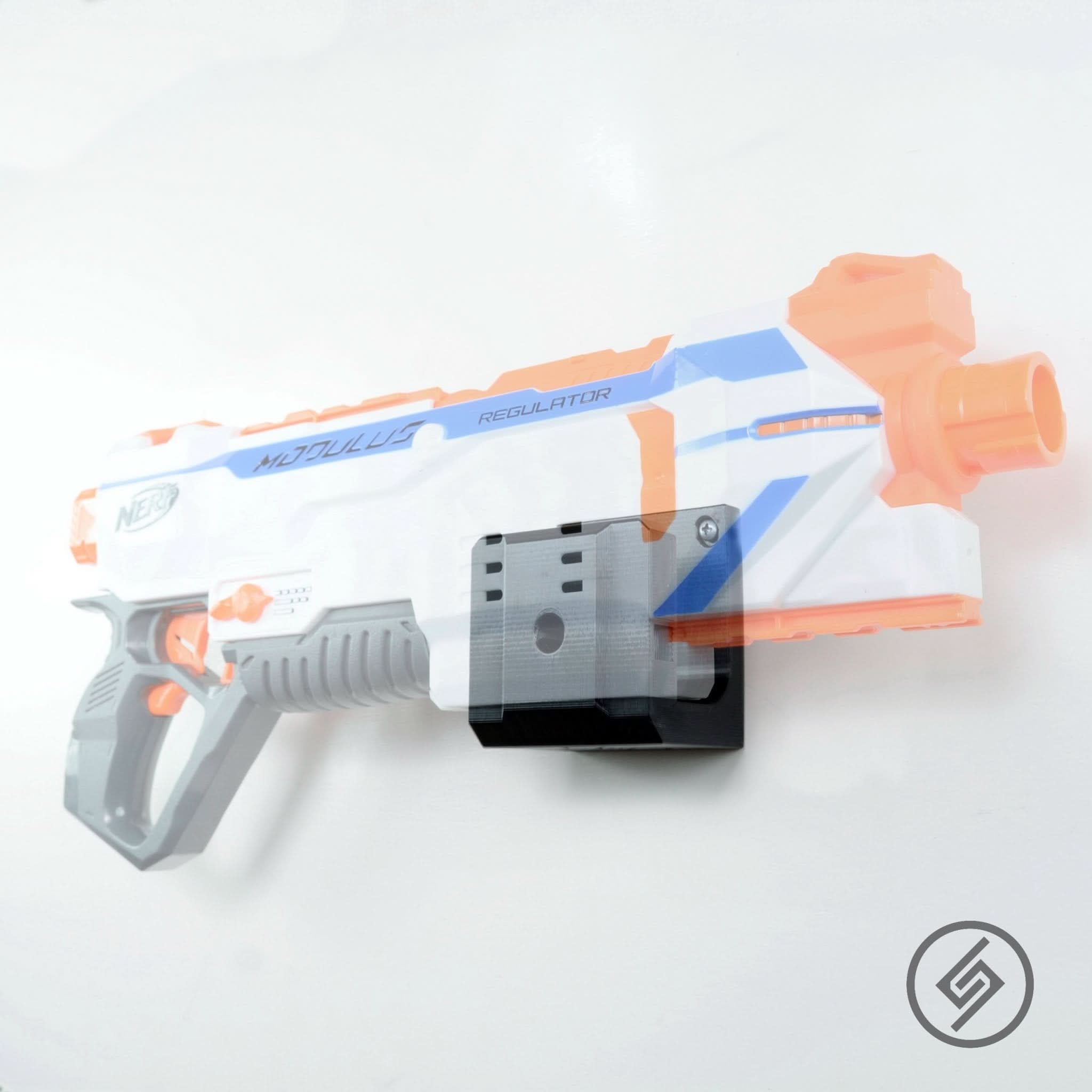 Nerf N-Strike blaster shown mounted on the Spartan Mounts wall hook for organized, off-the-floor storage