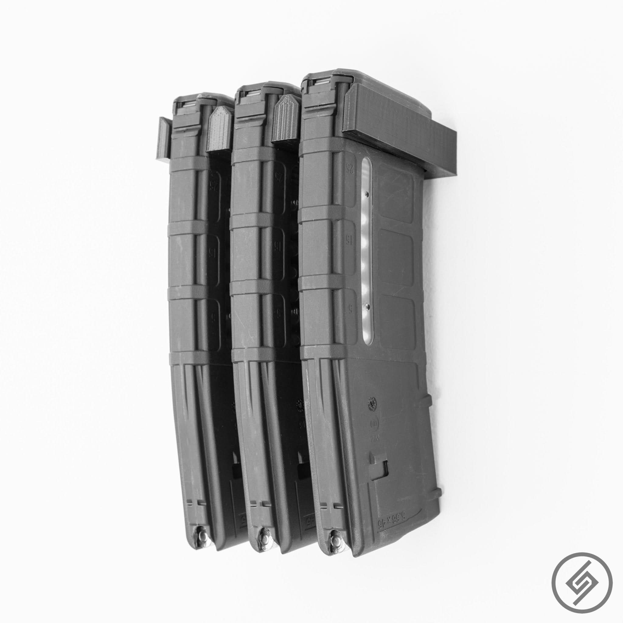 Three AR-15 PMAG magazines shown loaded in the Spartan Mounts wall rack for a clean, space-saving display