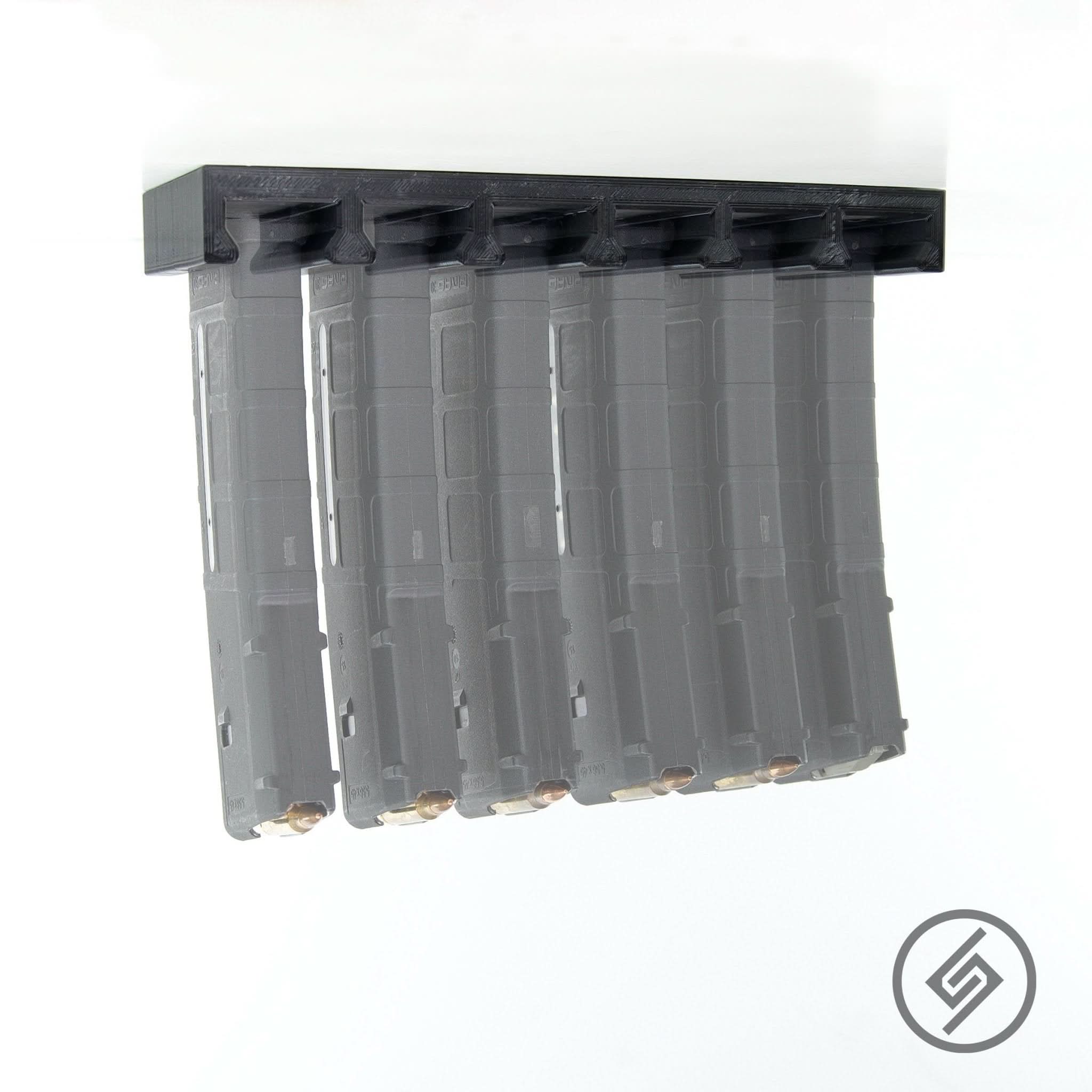 Six AR-15 PMAG magazines shown top-loaded in the Spartan Mounts wall rack for organized, off-the-floor storage