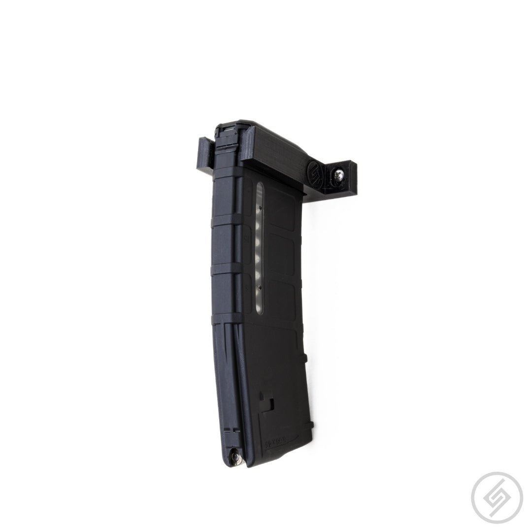 A pair of single AR-15 PMAG magazines shown loaded in the Spartan Mounts wall racks for organized, off-the-floor storage