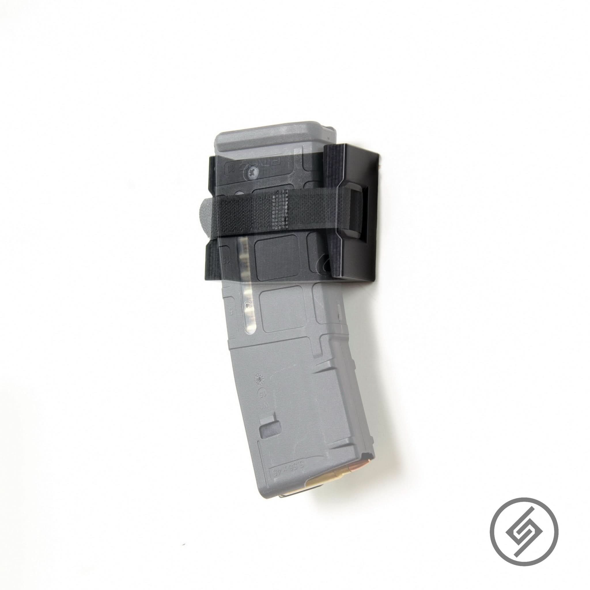 AR-15 PMAG magazines shown loaded in the Spartan Mounts Velcro-mount wall rack for organized, off-the-floor storage