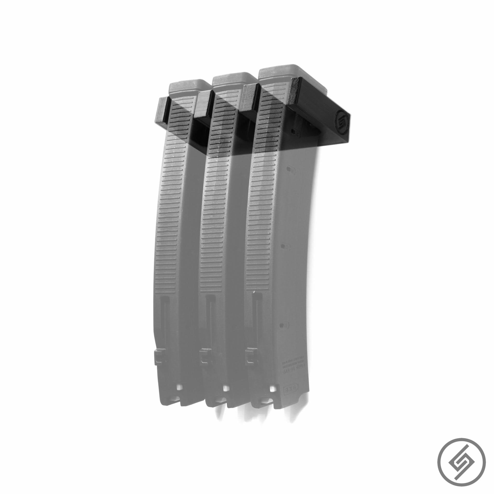 Three PMAG EV9 magazines shown loaded in the Spartan Mounts wall rack for a clean, space-saving display