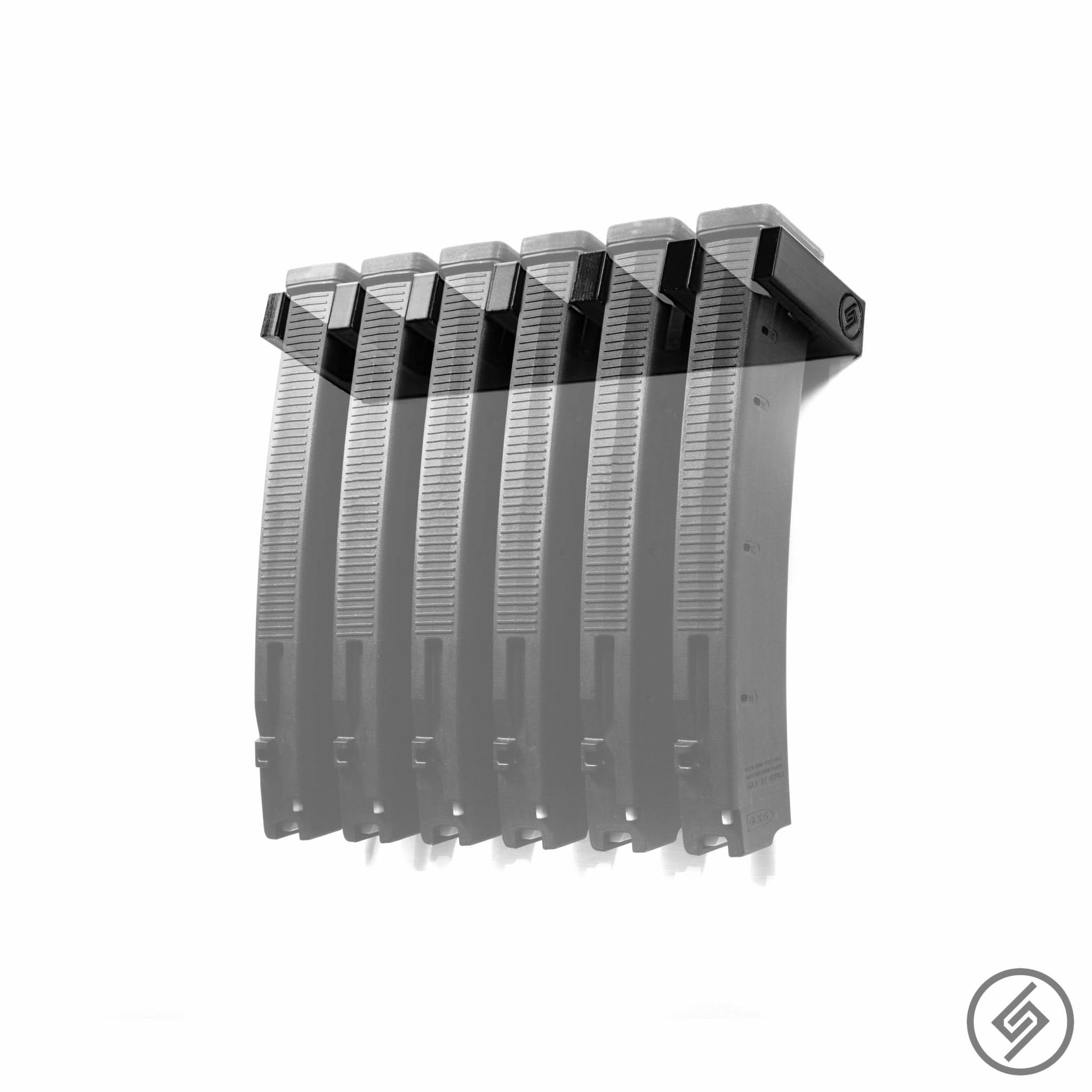 Six PMAG EV9 magazines shown loaded in the Spartan Mounts wall rack for organized, off-the-floor storage
