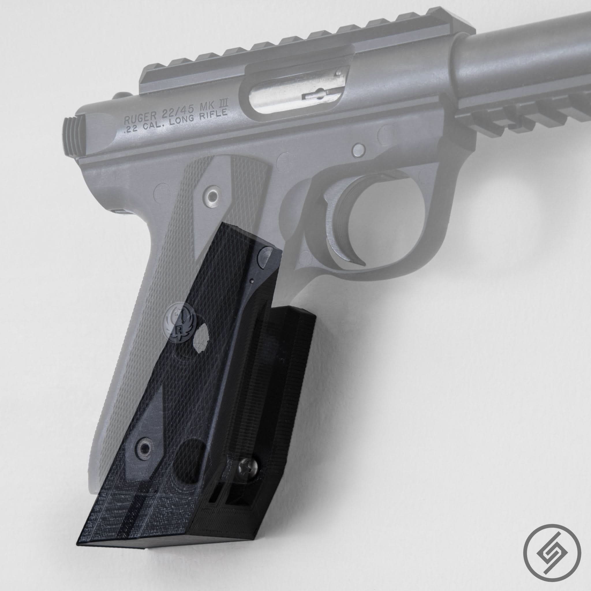 Ruger .22 pistol shown mounted on the Spartan Mounts wall hook for a clean, off-the-floor display