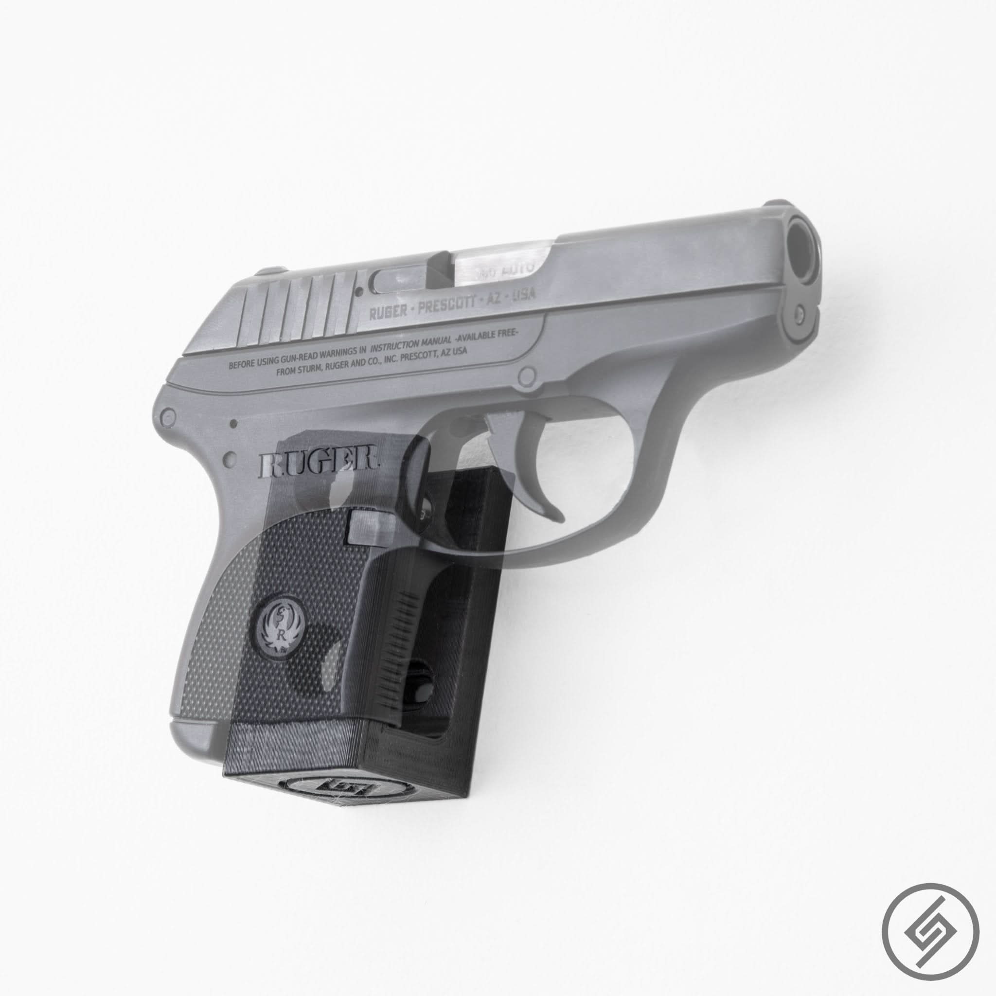 Ruger LCP MAX pistol shown mounted on the Spartan Mounts wall hook for a clean, quick-access display