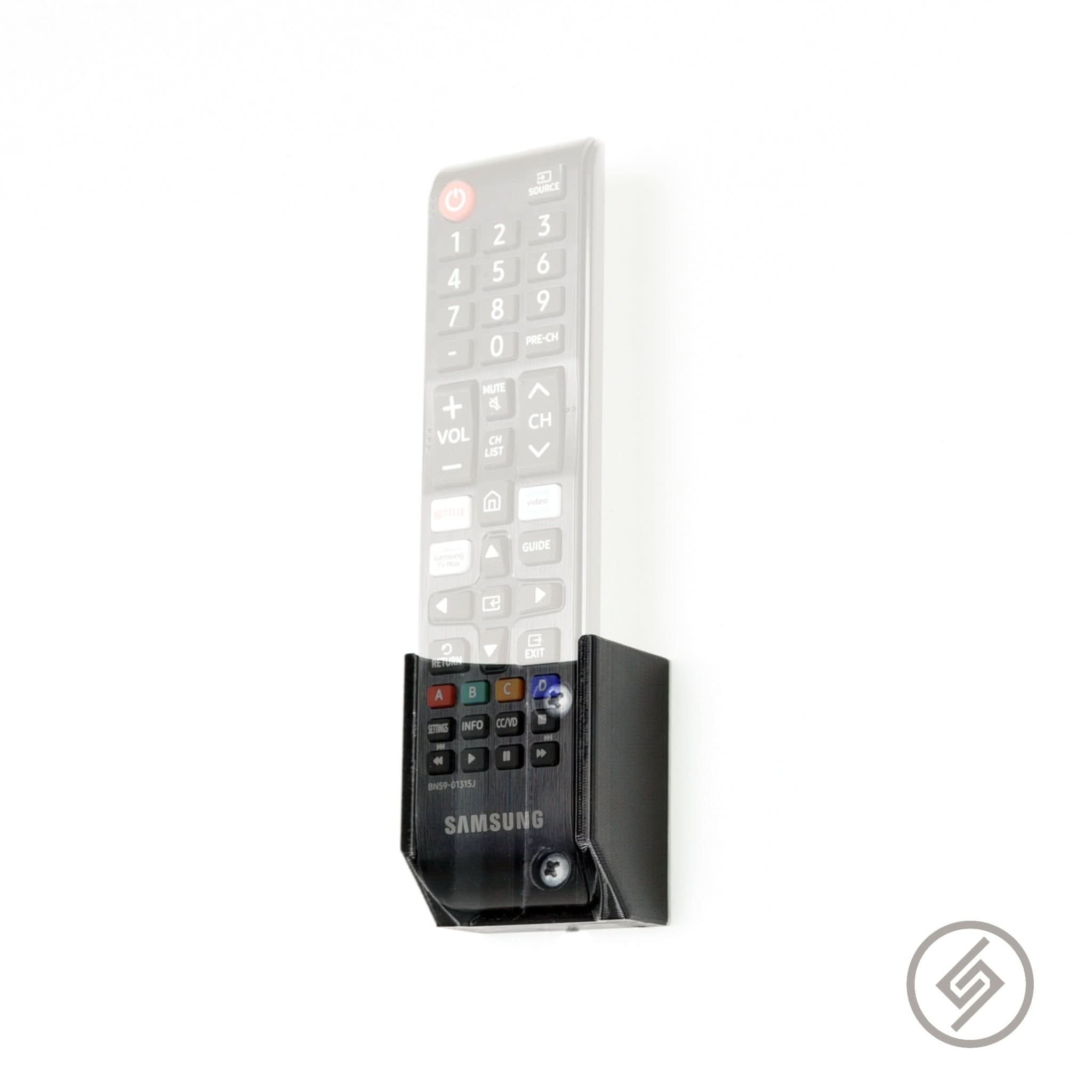 Samsung TV remote shown mounted on the Spartan Mounts wall mount for a clean, easy-access setup