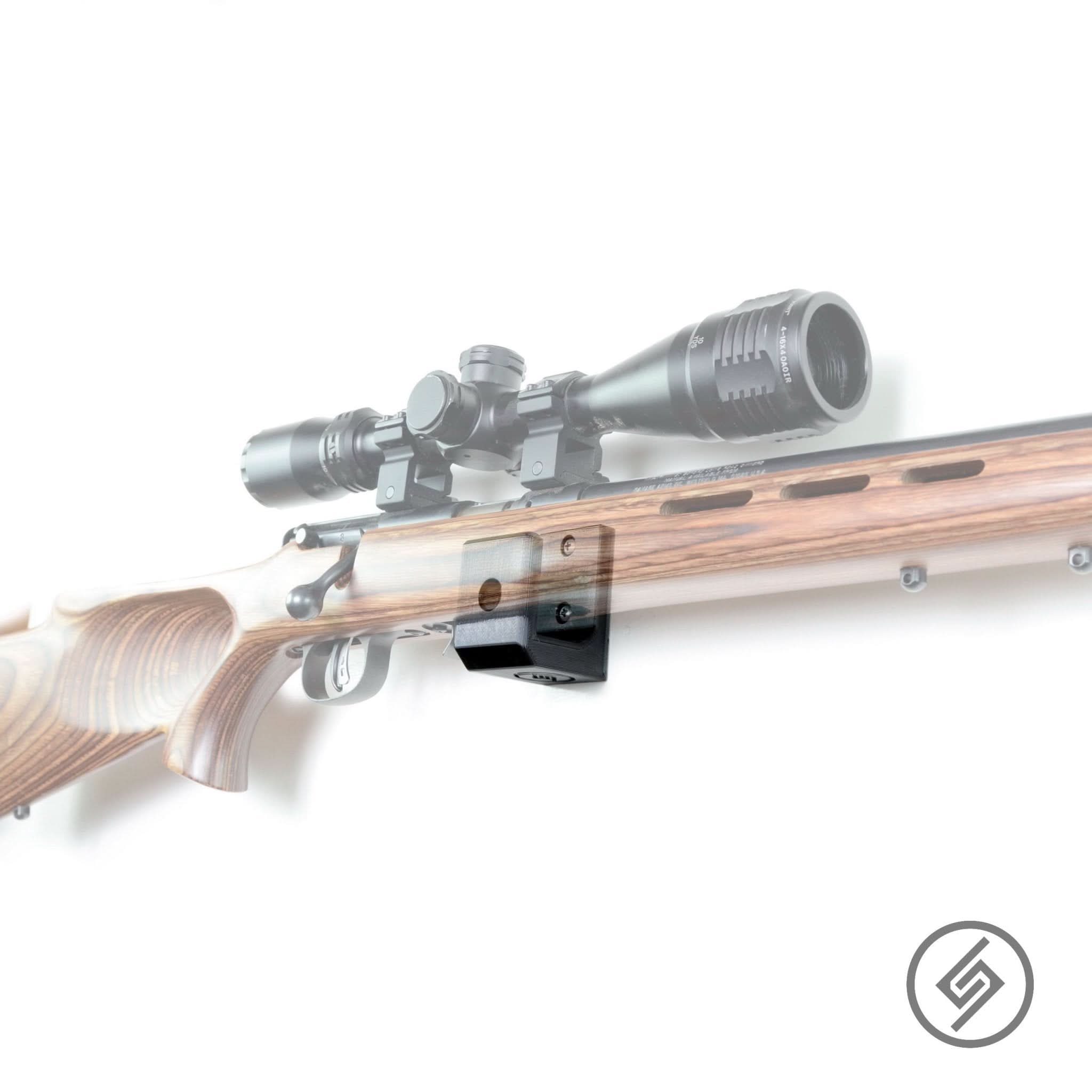 Savage 62/64/954 rifle shown mounted on the Spartan Mounts wall hook for secure, quick-access storage