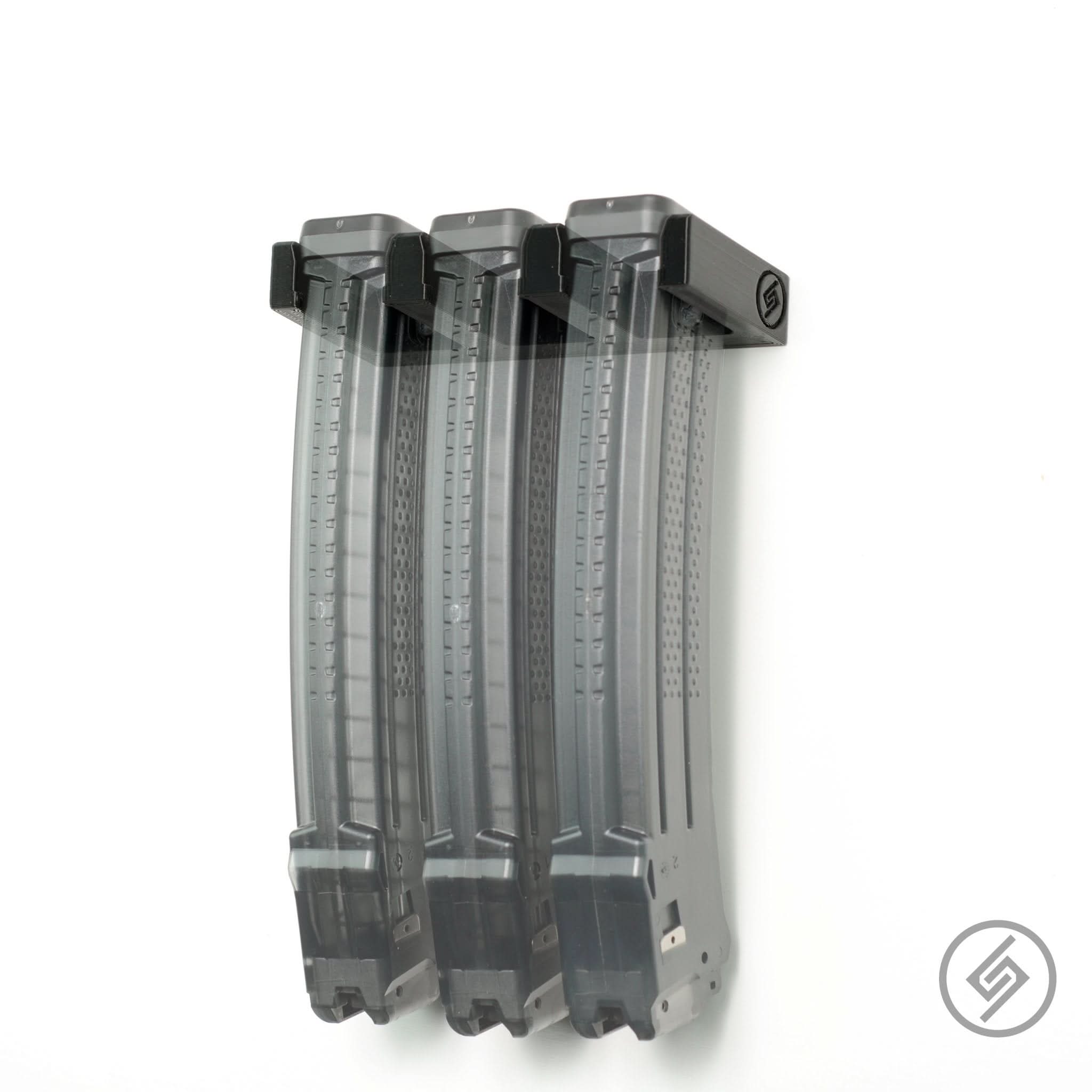 SIG MPX magazines shown loaded in the Spartan Mounts wall rack for organized, off-the-floor storage
