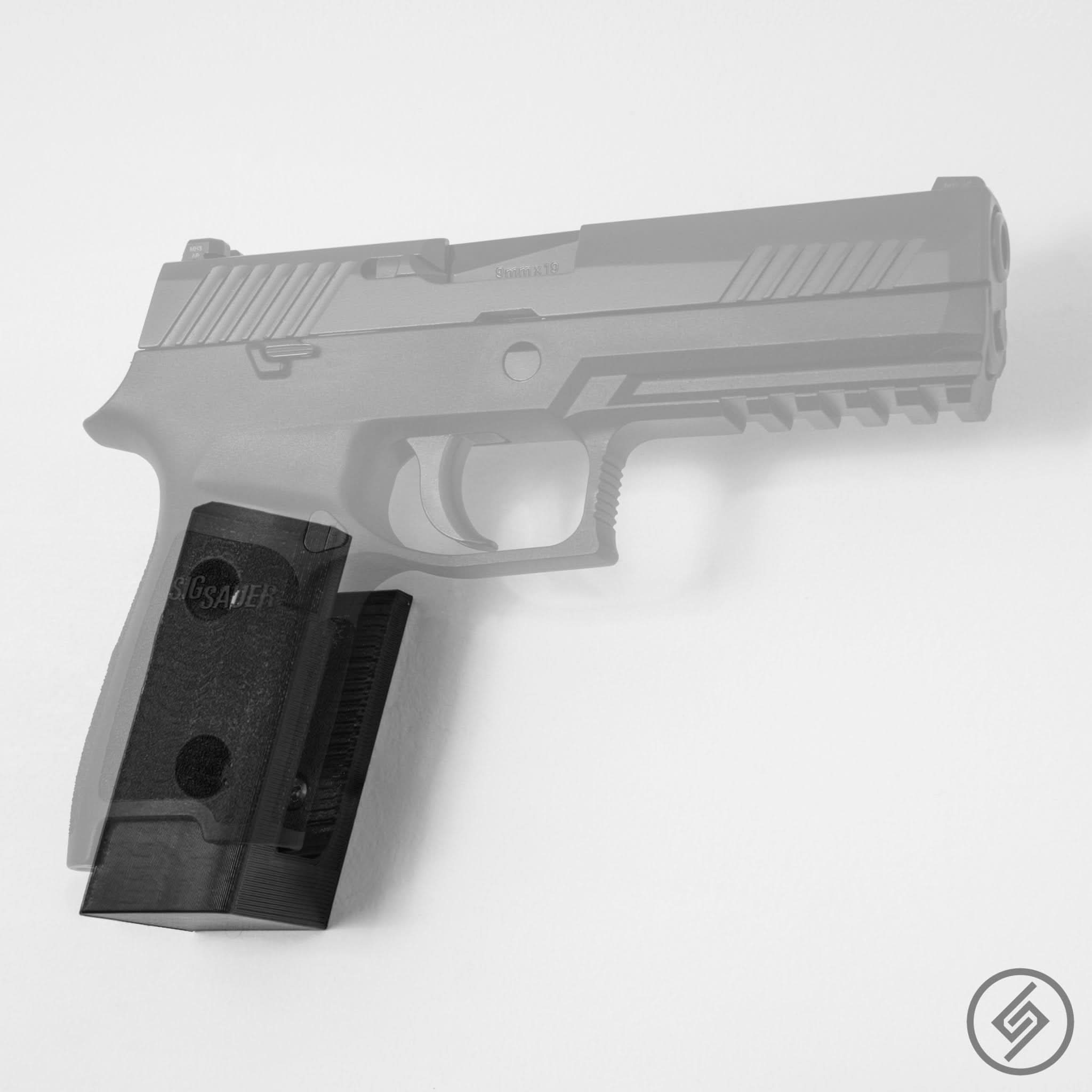 SIG P229, P250, and P320 pistol shown mounted on the Spartan Mounts wall hook for secure gun room storage