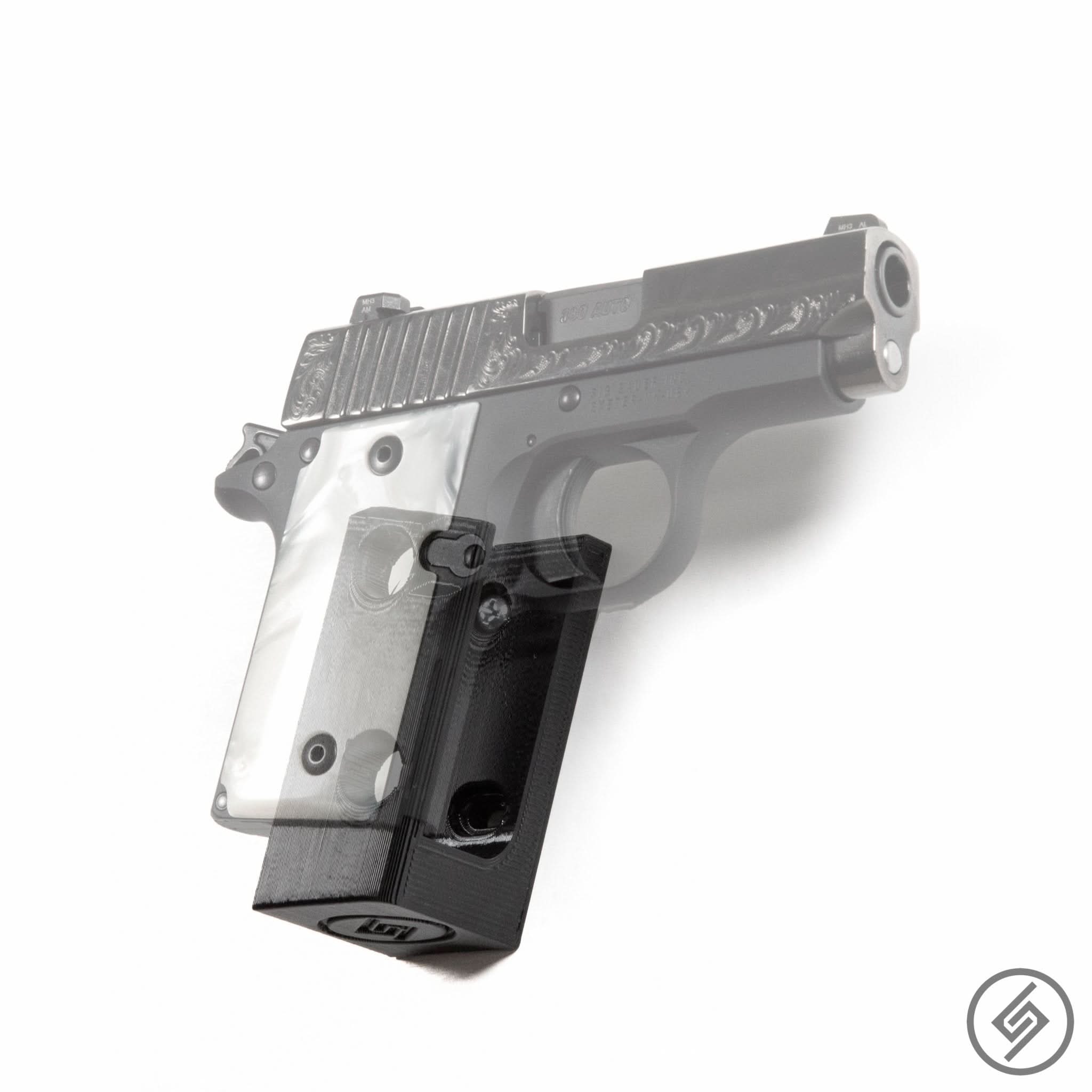 SIG P938 pistol shown mounted on the Spartan Mounts wall hook for a clean, quick-access display
