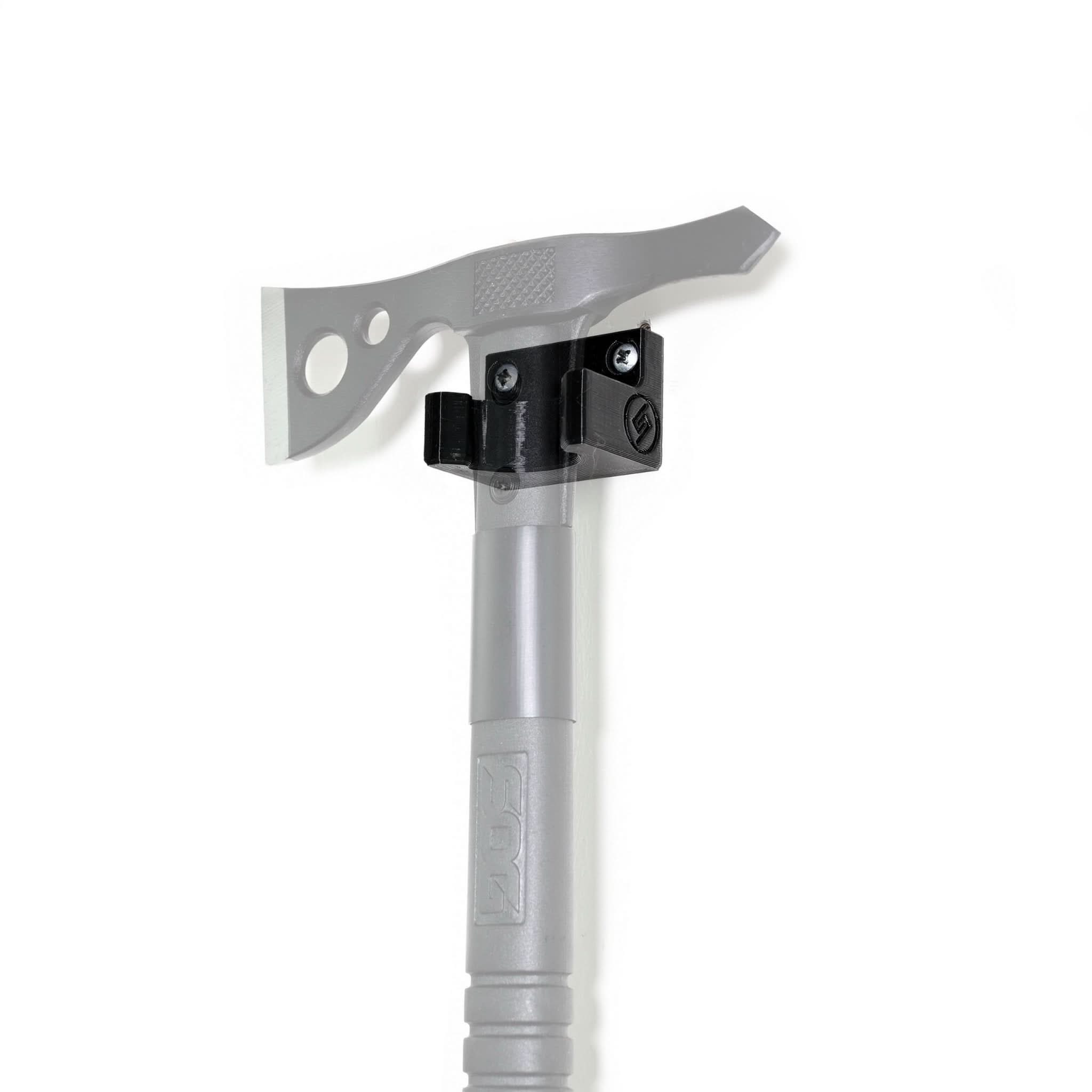 SOG FastHawk tomahawk shown mounted on the Spartan Mounts wall mount for a clean, off-the-floor display