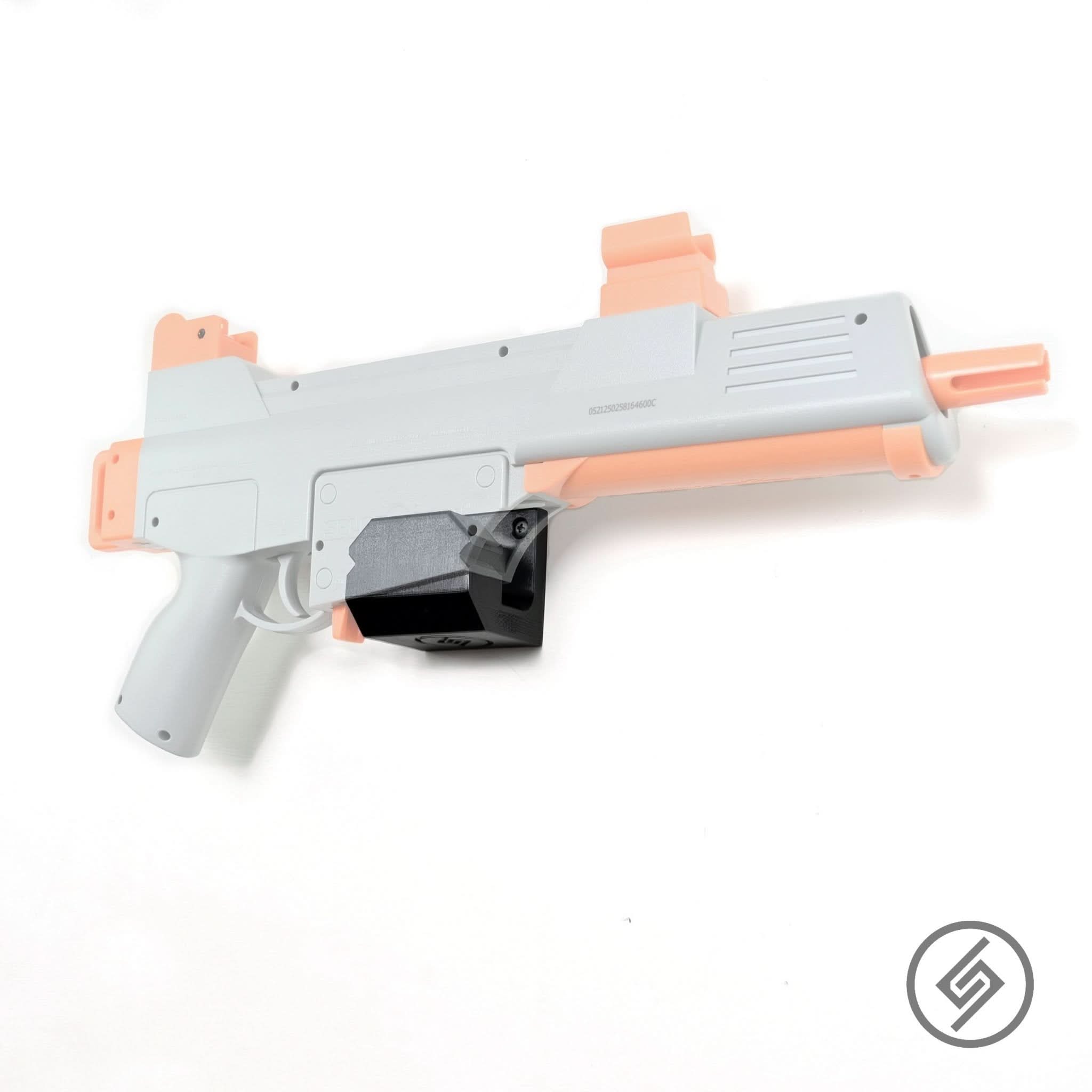 Splat-R-Ball gel blaster shown mounted on the Spartan Mounts wall hook for organized, off-the-floor storage