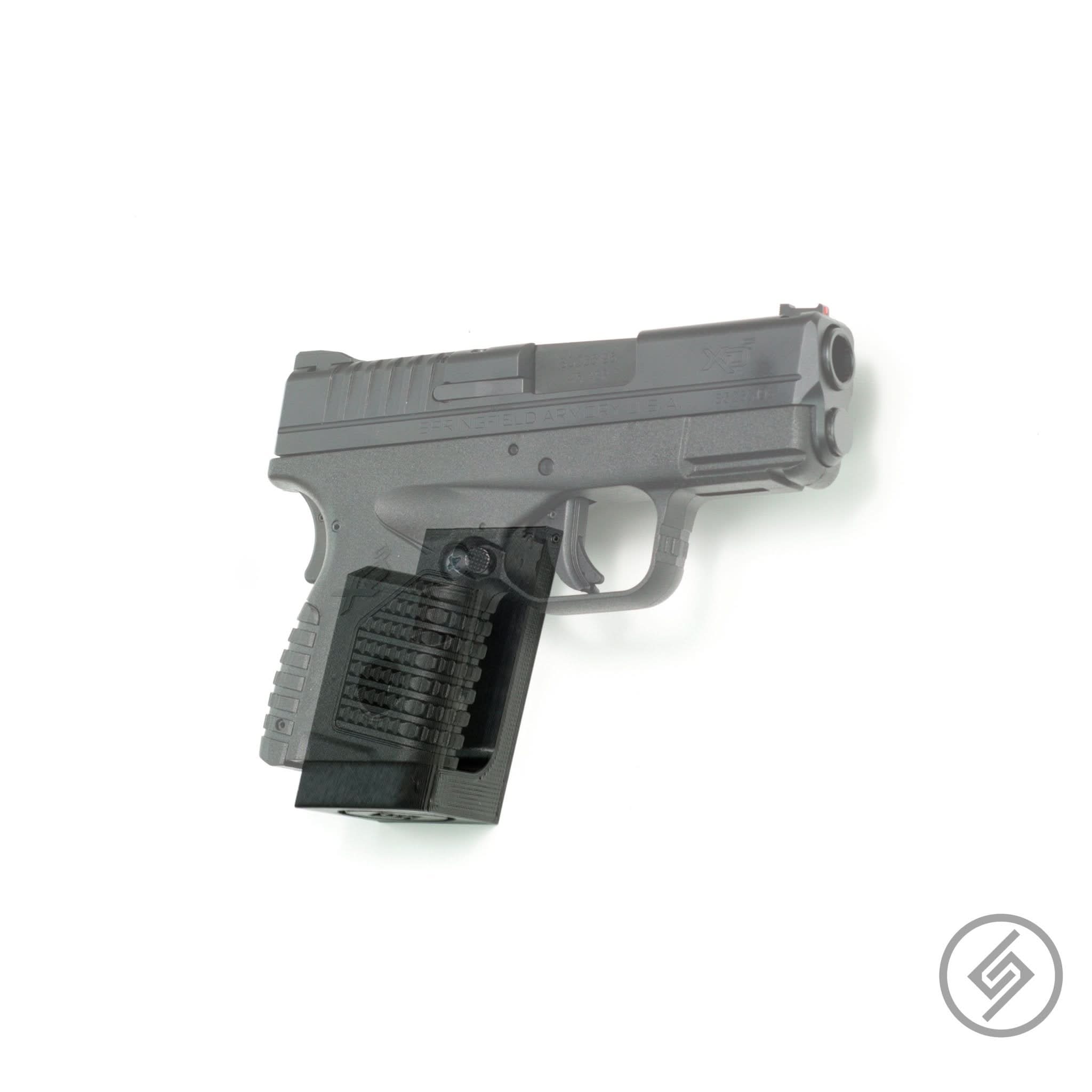 Springfield Hellcat pistol shown mounted on the Spartan Mounts wall hook for a clean, quick-access display