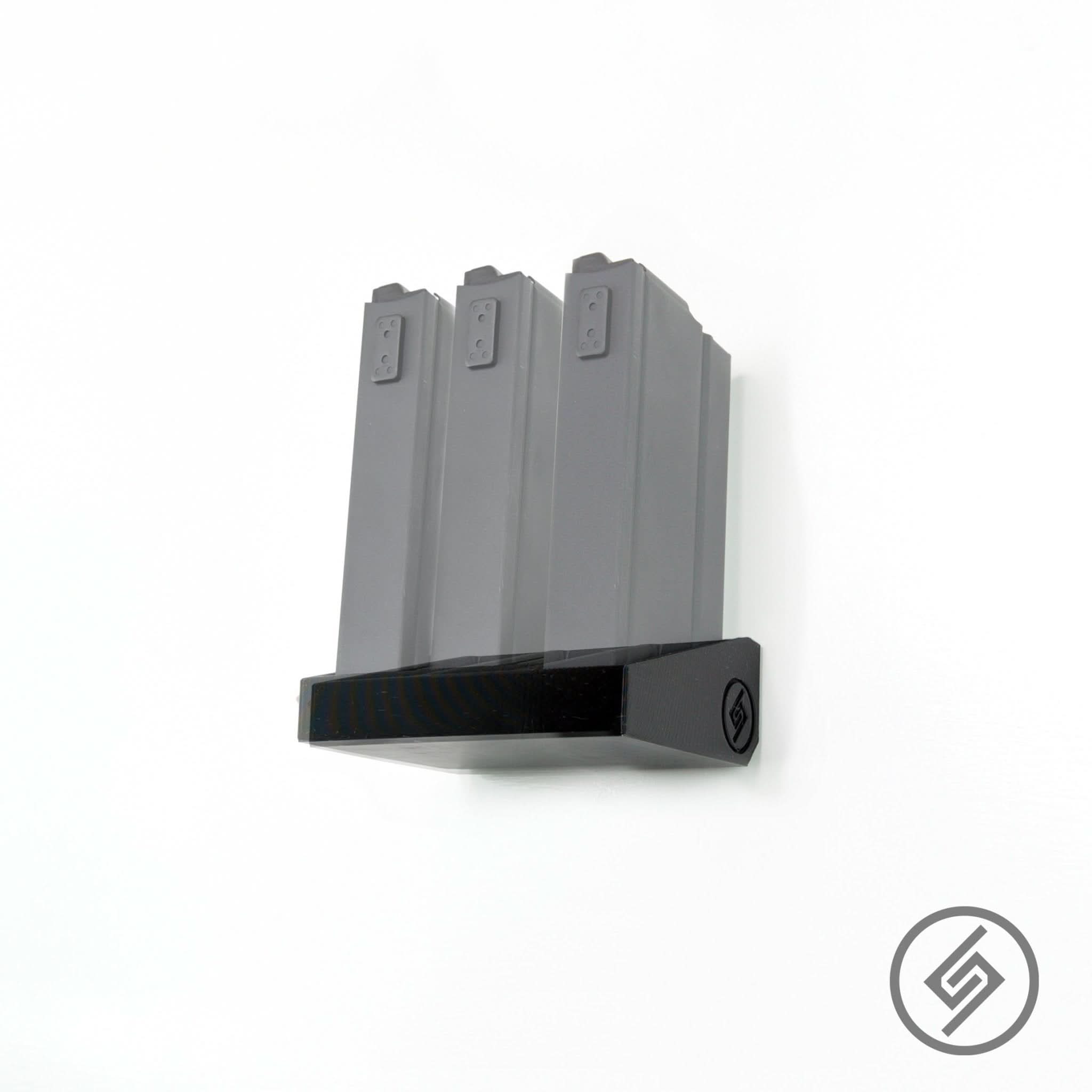 Springfield M14/M1A magazines shown loaded in the Spartan Mounts metal wall rack for organized, off-the-floor storage