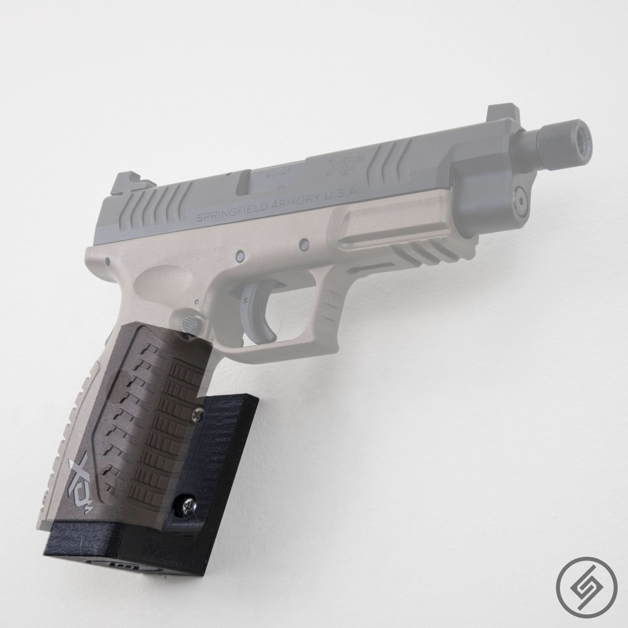 Springfield XDM pistol shown mounted on the Spartan Mounts wall hook for secure, quick-access storage