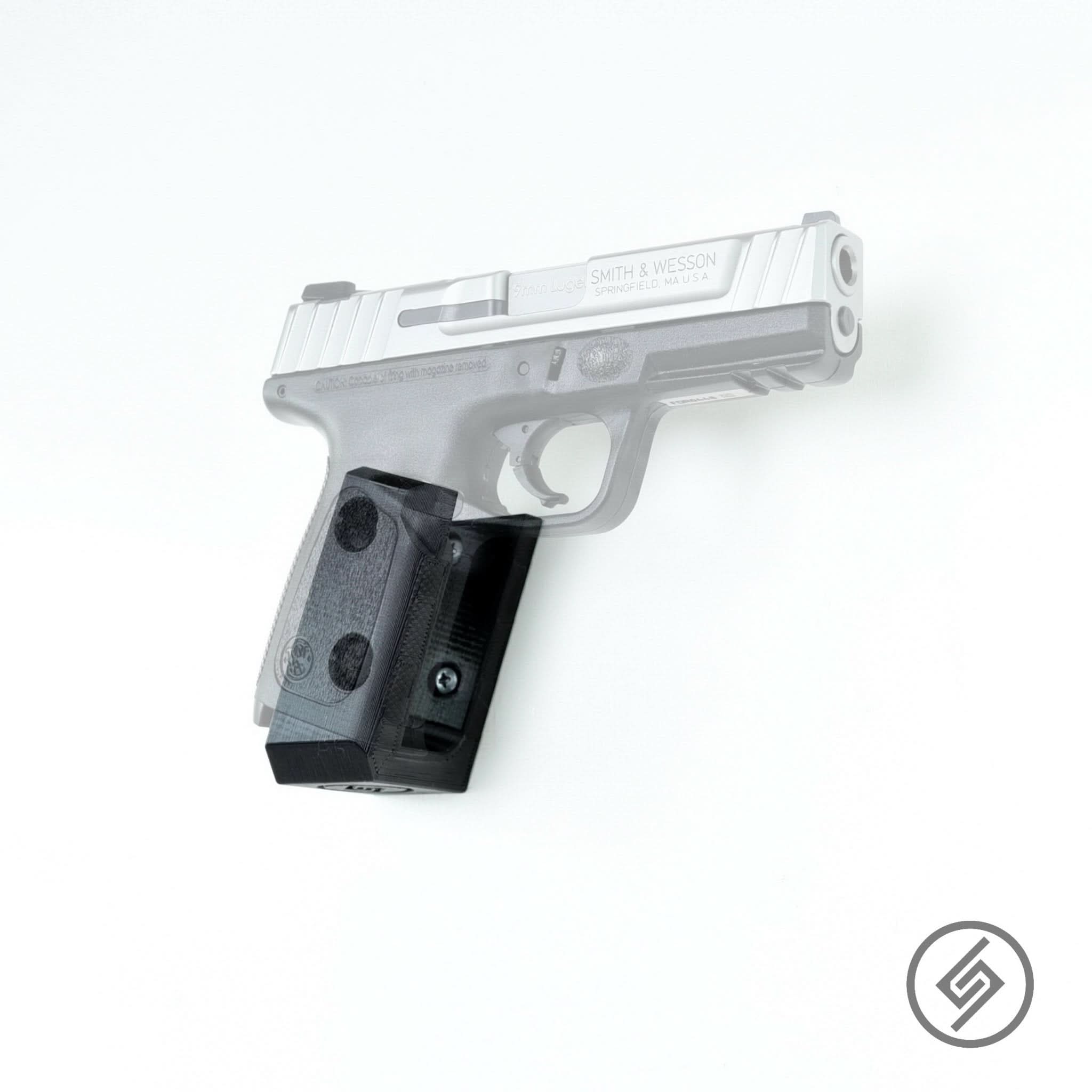 S&W SD9VE pistol shown mounted on the Spartan Mounts wall hook for a clean, quick-access display