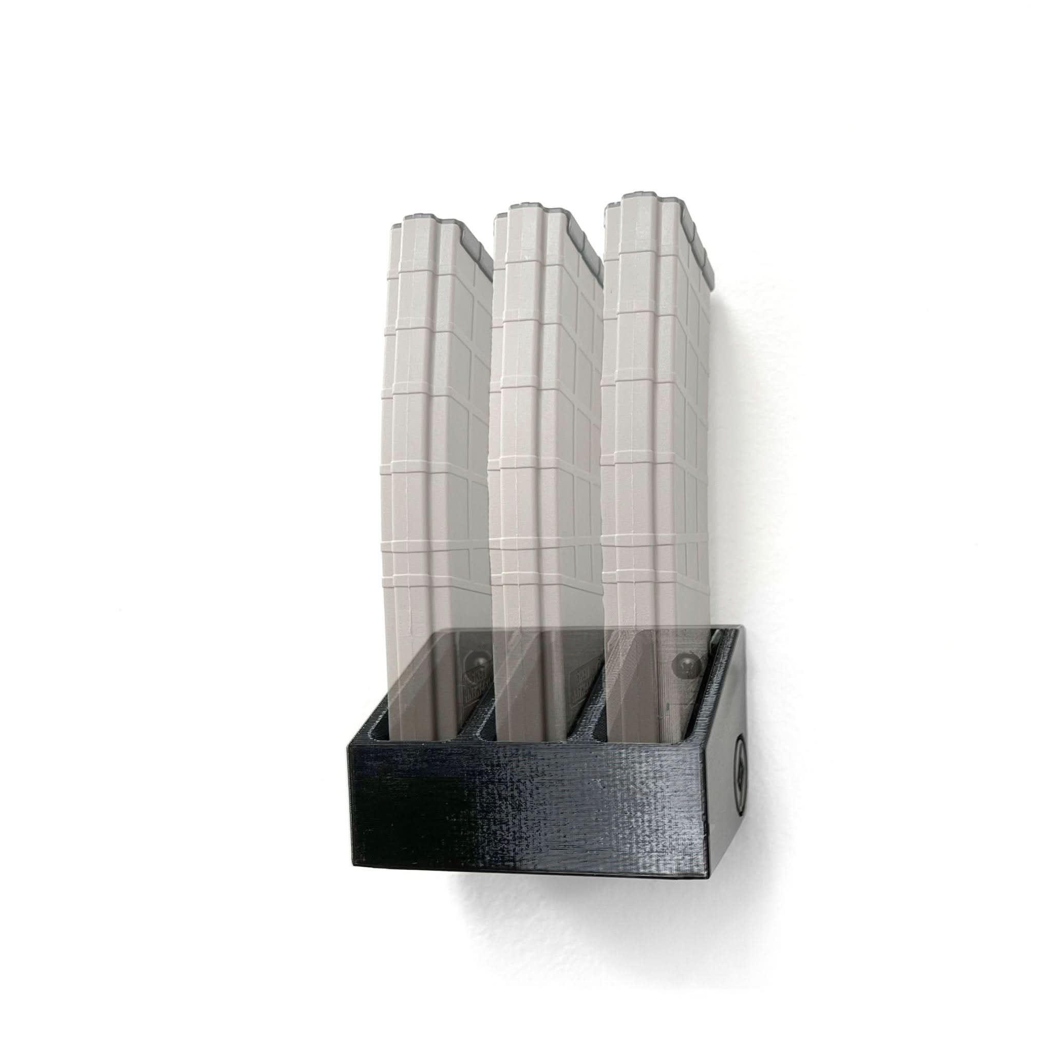 Tippmann Arms M4-22 magazines shown loaded in the Spartan Mounts wall rack for organized, off-the-floor storage