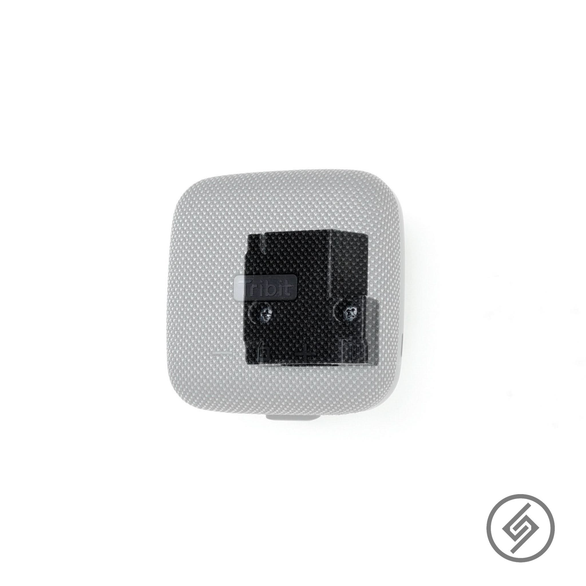 Tribit StormBox Micro speaker shown mounted on the Spartan Mounts wall mount for a clean, space-saving setup