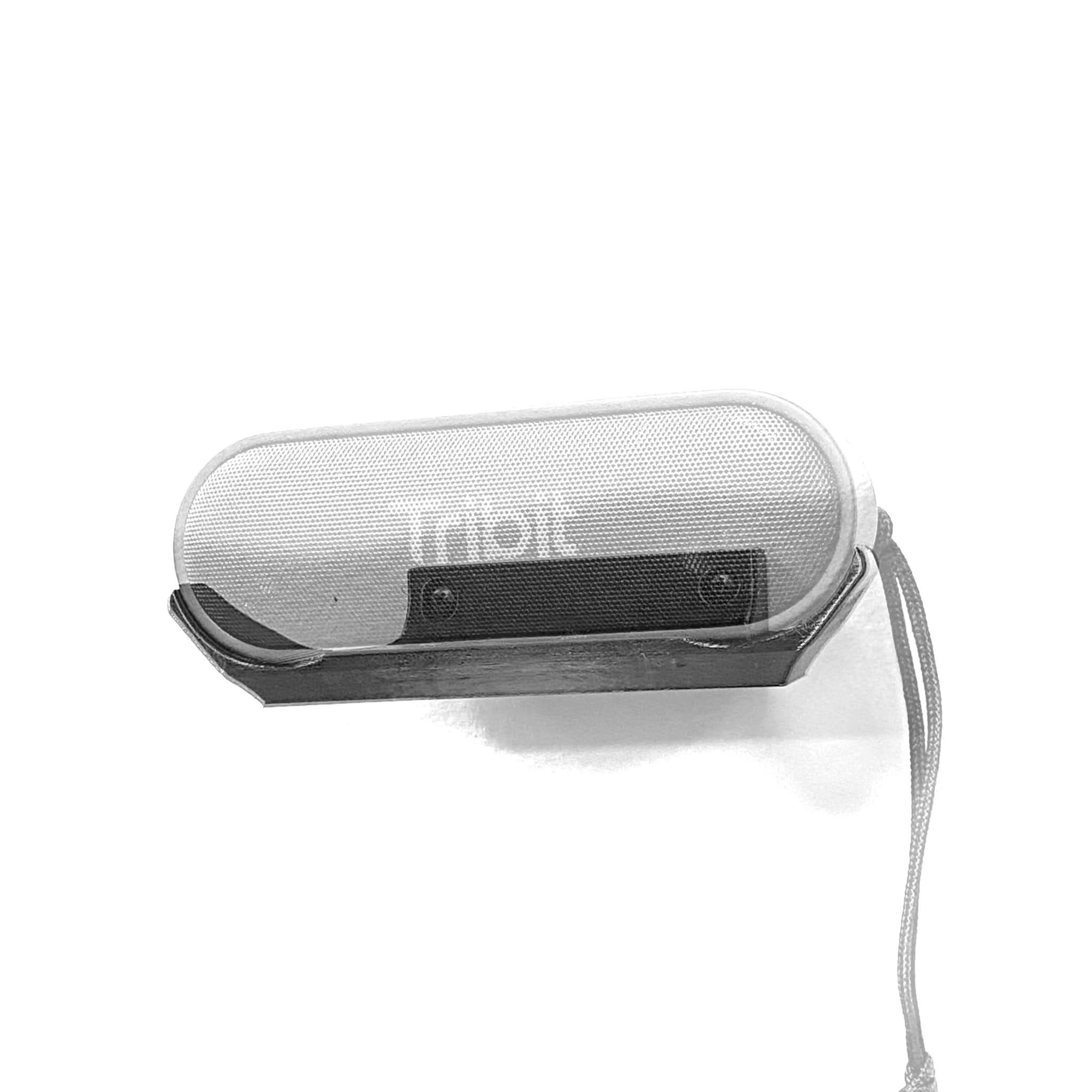 Tribit XSound Go speaker shown mounted on the Spartan Mounts wall mount for a clean, space-saving setup