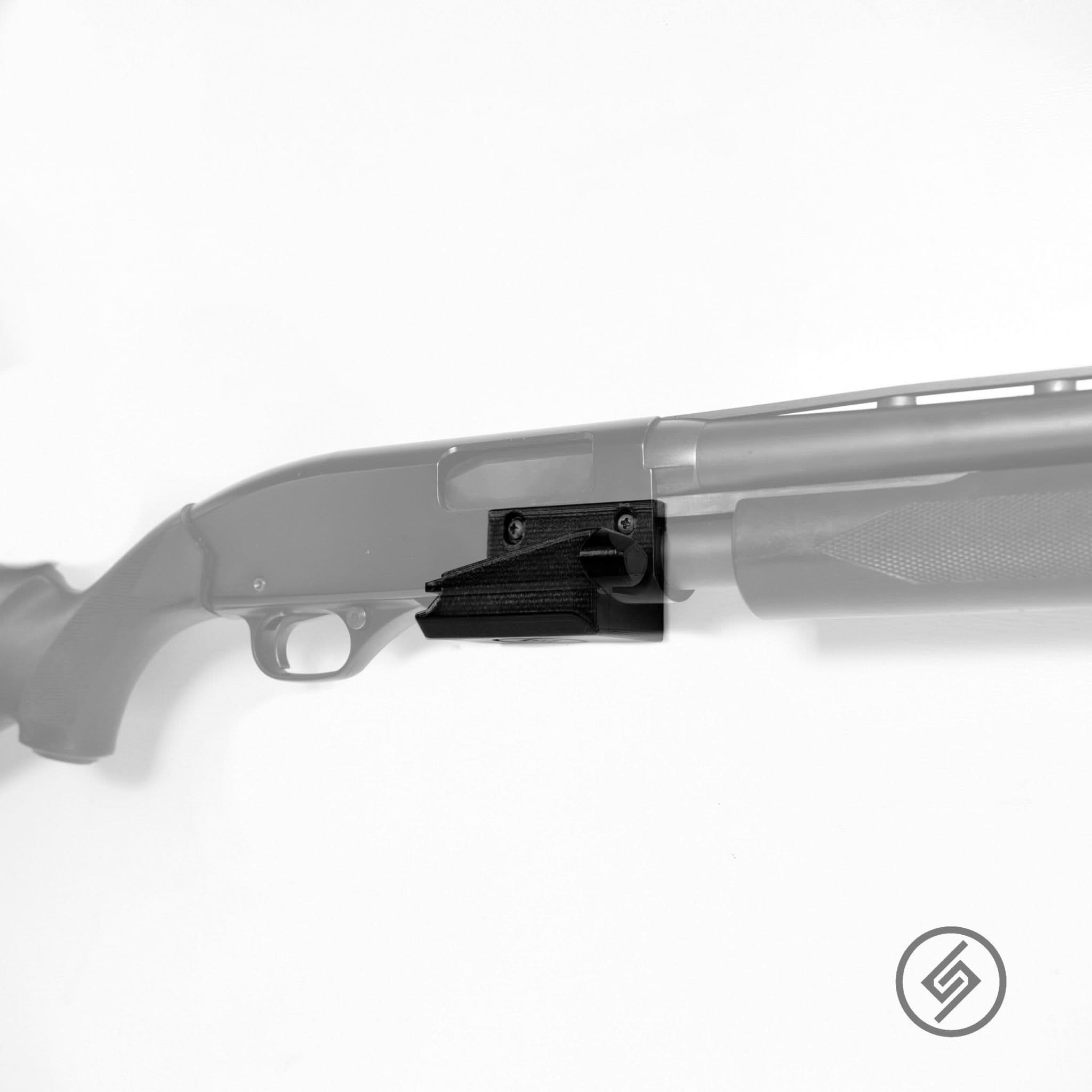 Winchester 1300 12 gauge shotgun shown mounted on the Spartan Mounts wall hook for secure, quick-access storage