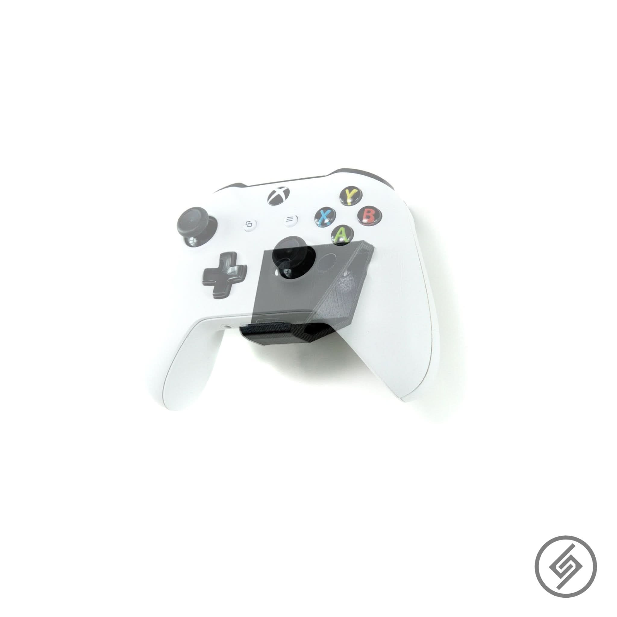 Xbox One controller shown mounted on the Spartan Mounts wall hook for organized, off-the-floor storage