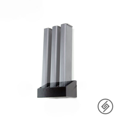 Colt 9mm magazines shown loaded in the Spartan Mounts wall rack for a clean, space-saving display