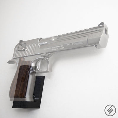Desert Eagle pistol shown mounted on the Spartan Mounts wall hook for a clean, quick-access display