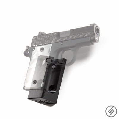SIG P938 pistol shown mounted on the Spartan Mounts wall hook for a clean, quick-access display