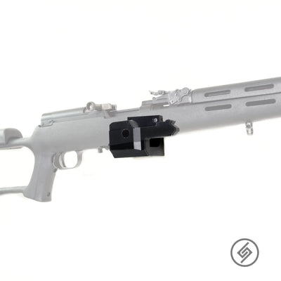 SKS rifle shown mounted on the Spartan Mounts wall hook for secure, quick-access storage